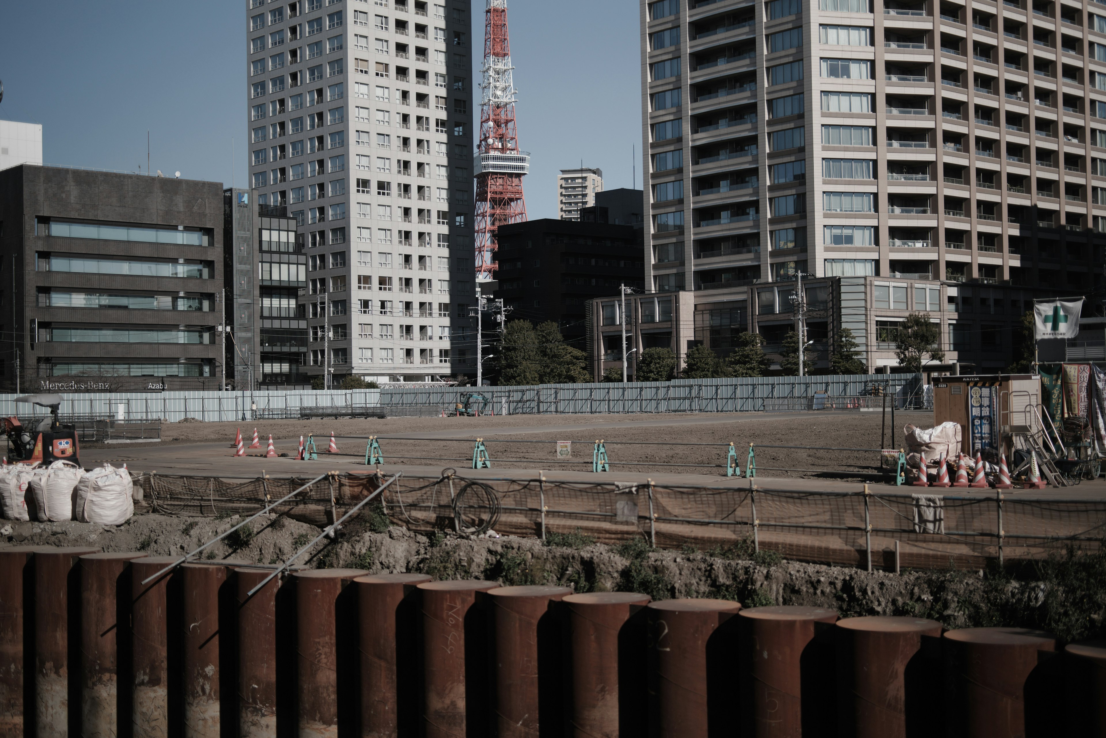 Urban construction site with surrounding skyscrapers