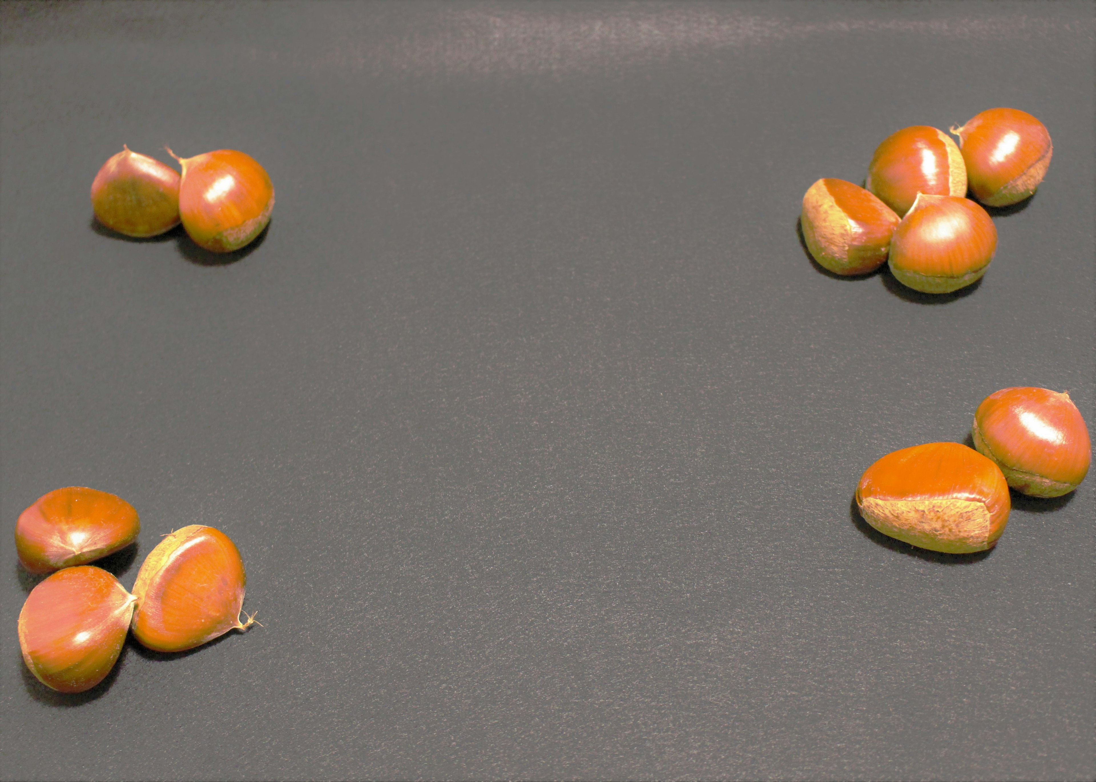 Several small orange objects arranged on a table