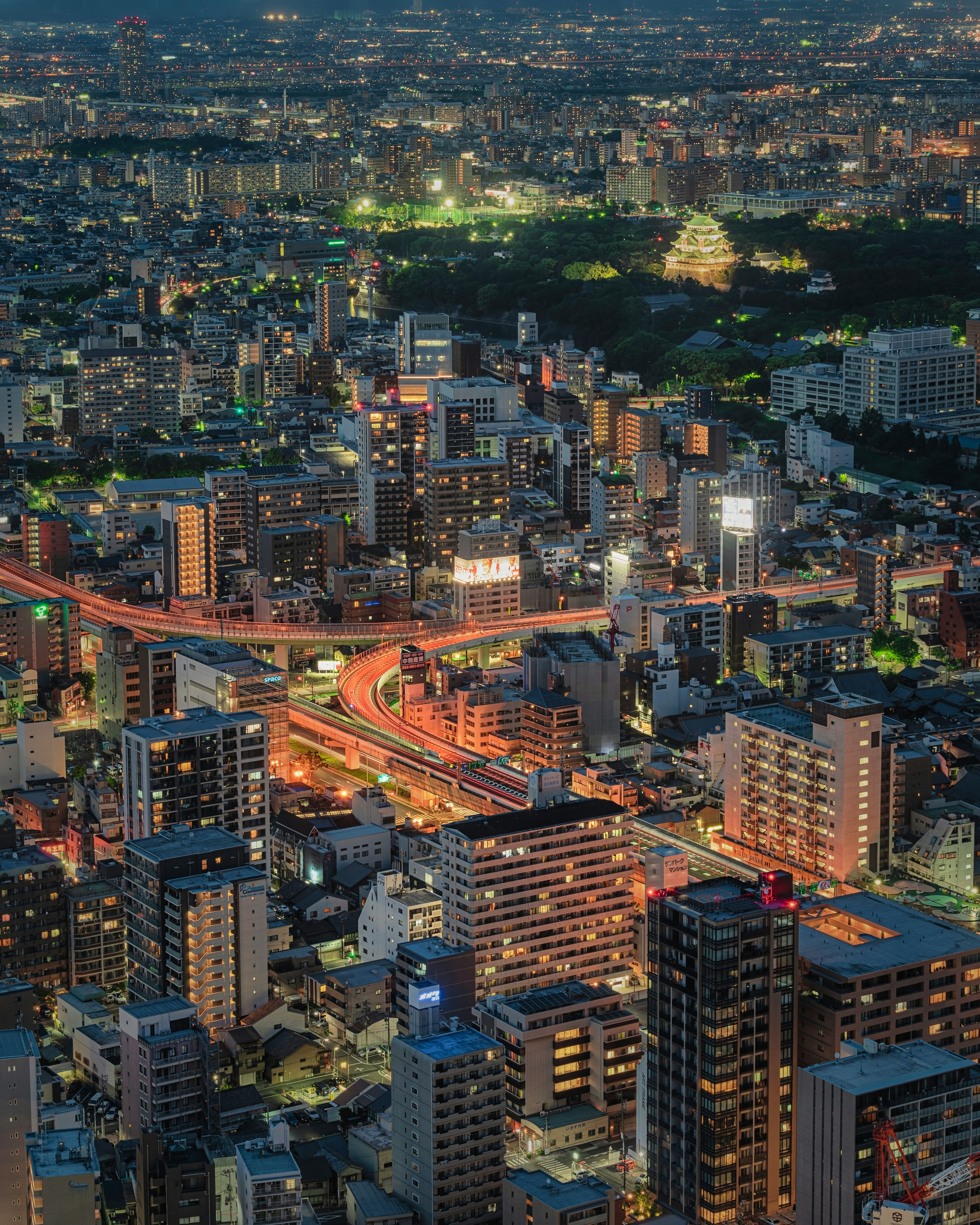 Night cityscape with illuminated skyscrapers and lighted streets