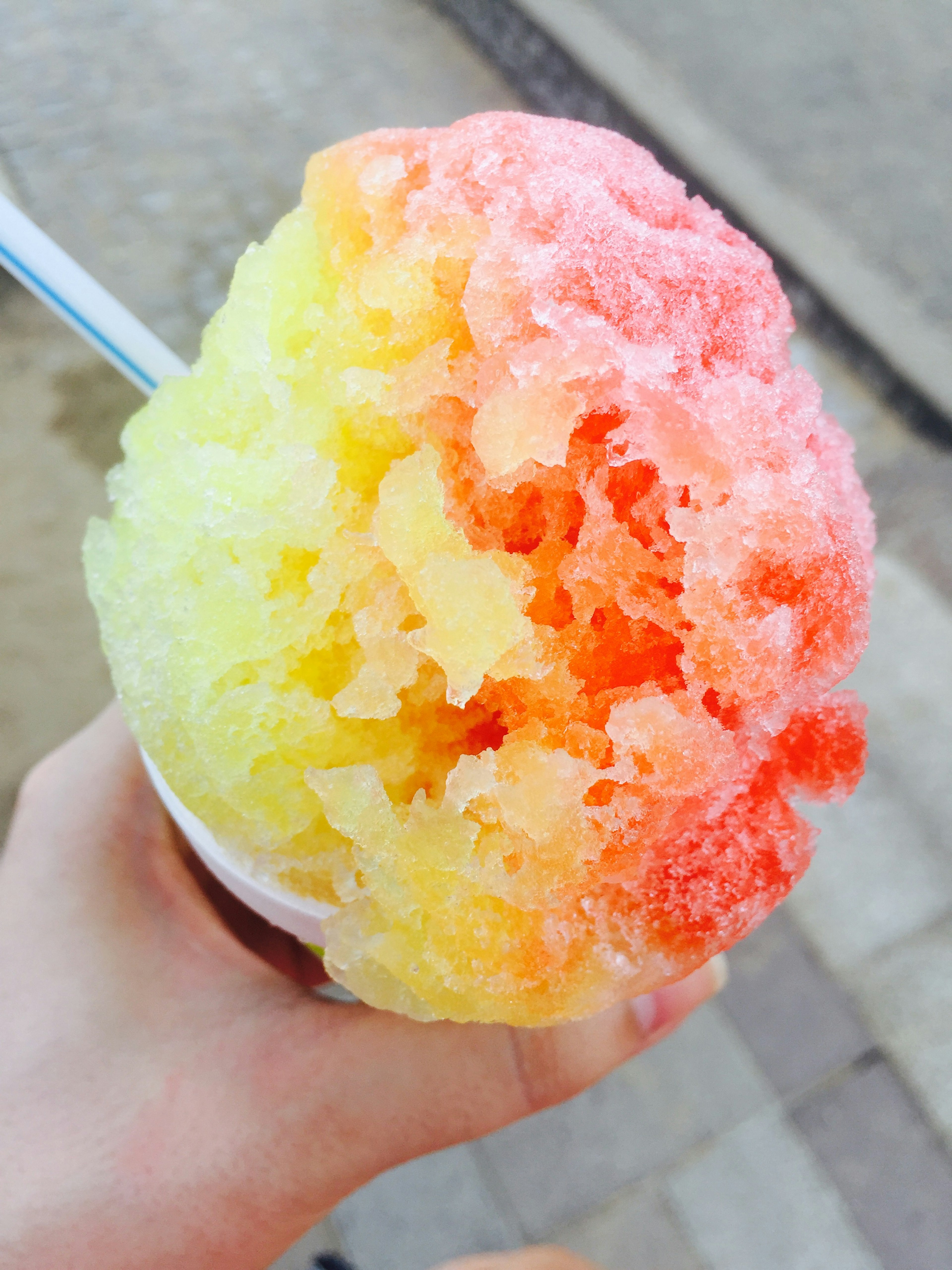 Colorful shaved ice held in a hand