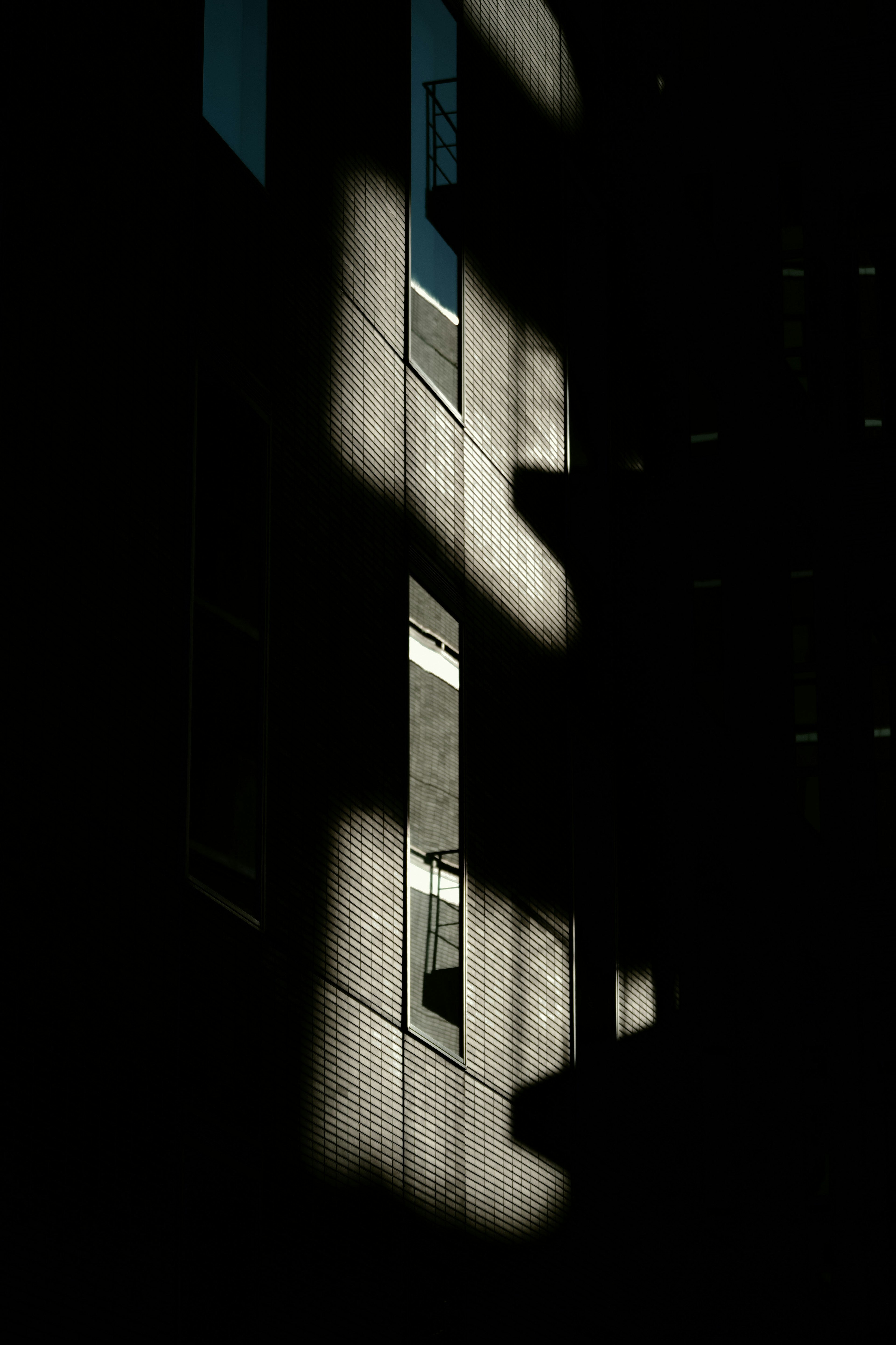 Contrast of light and shadow on a building surface