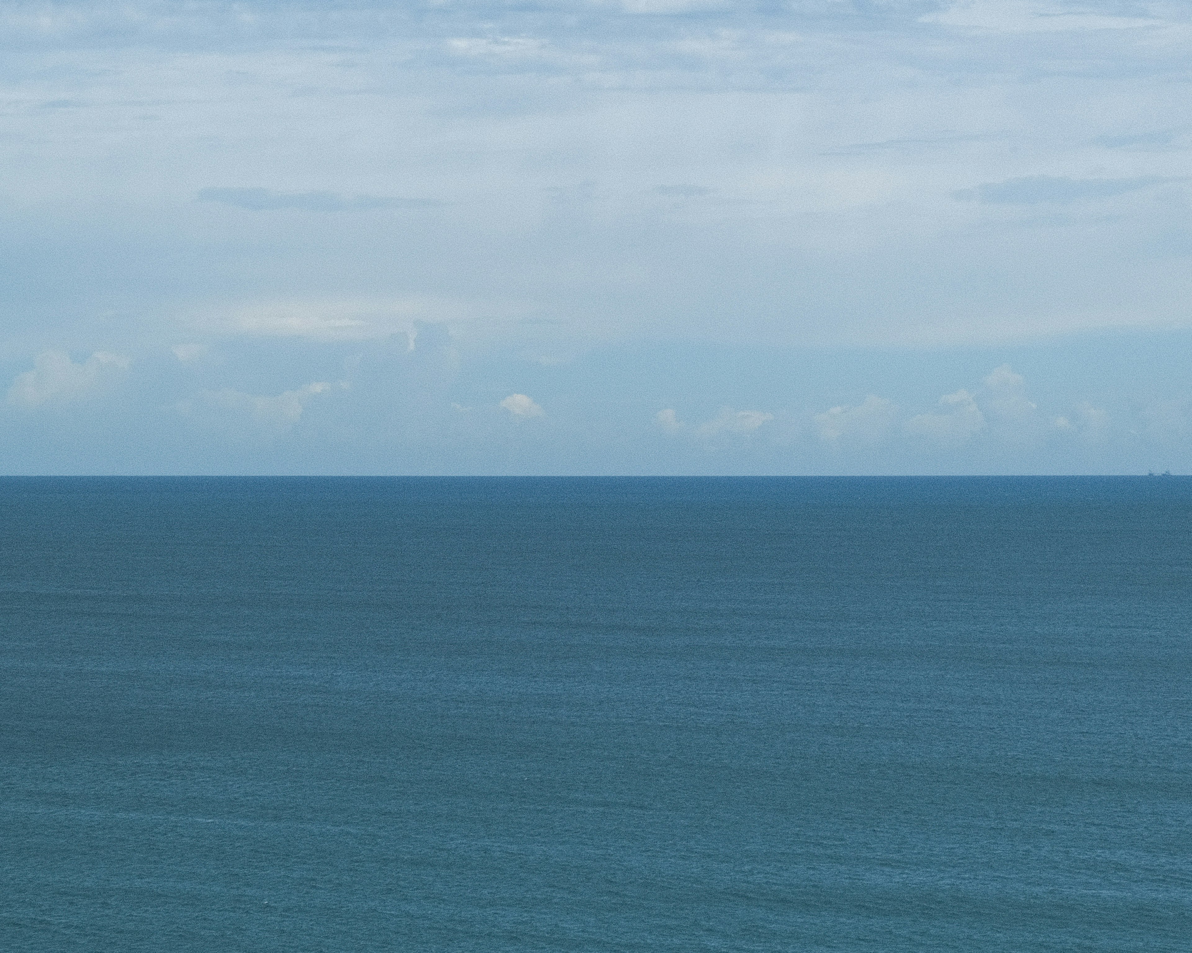 Vast blue sea under a bright sky