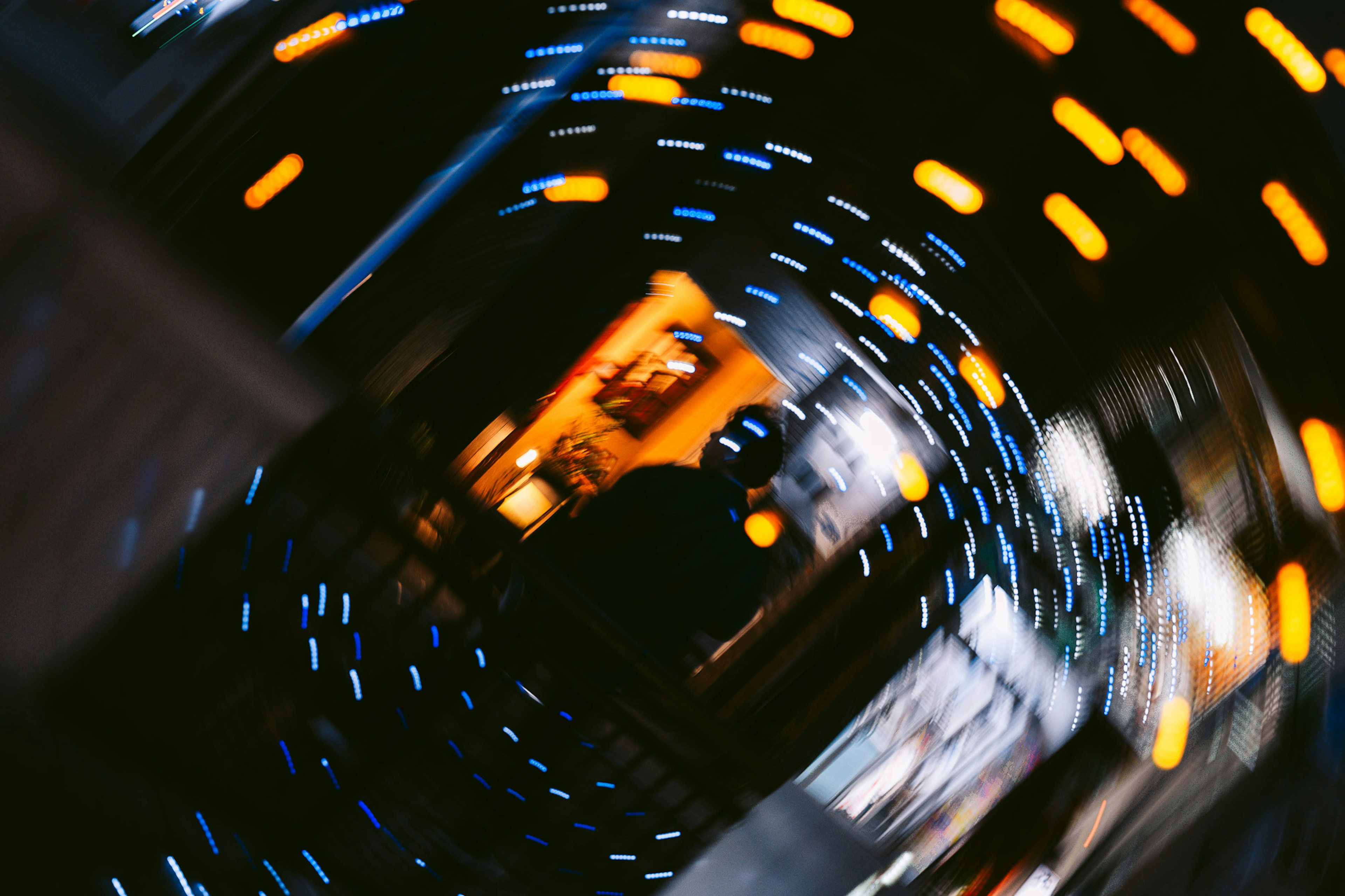 Blurred swirl of lights depicting a city scene at night