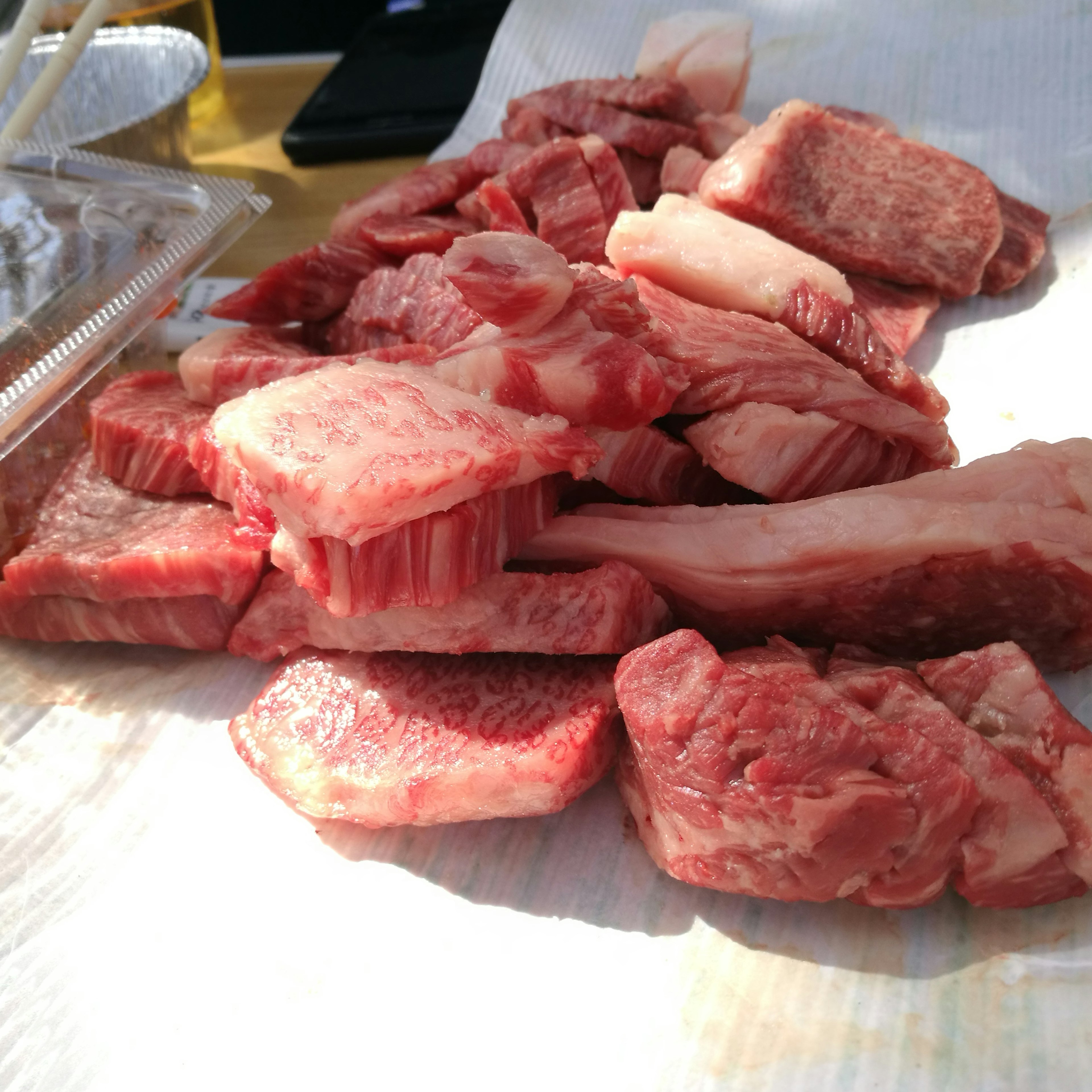 A selection of fresh meat cuts displayed on a table