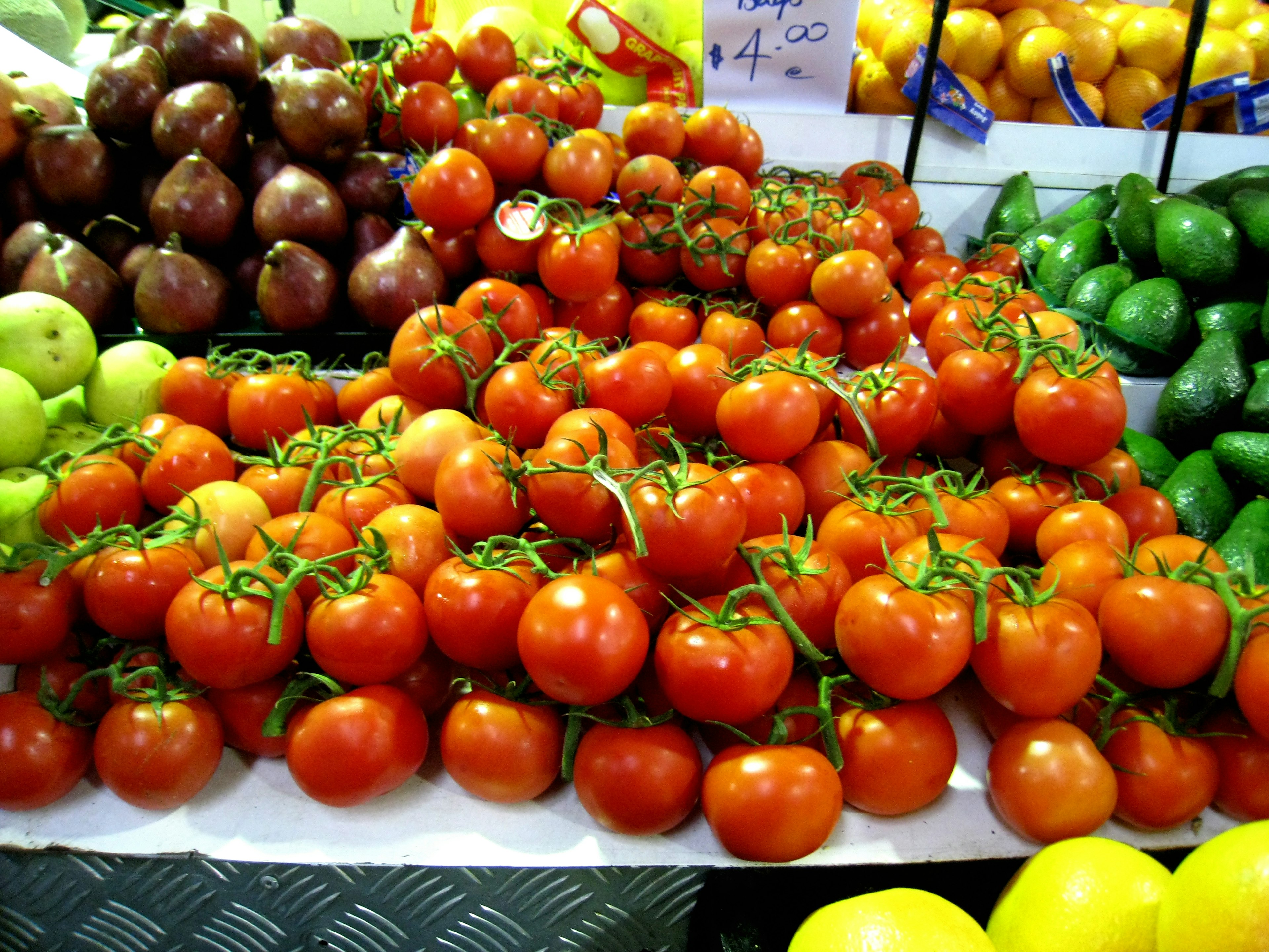 Fresh tomatoes displayed at a market