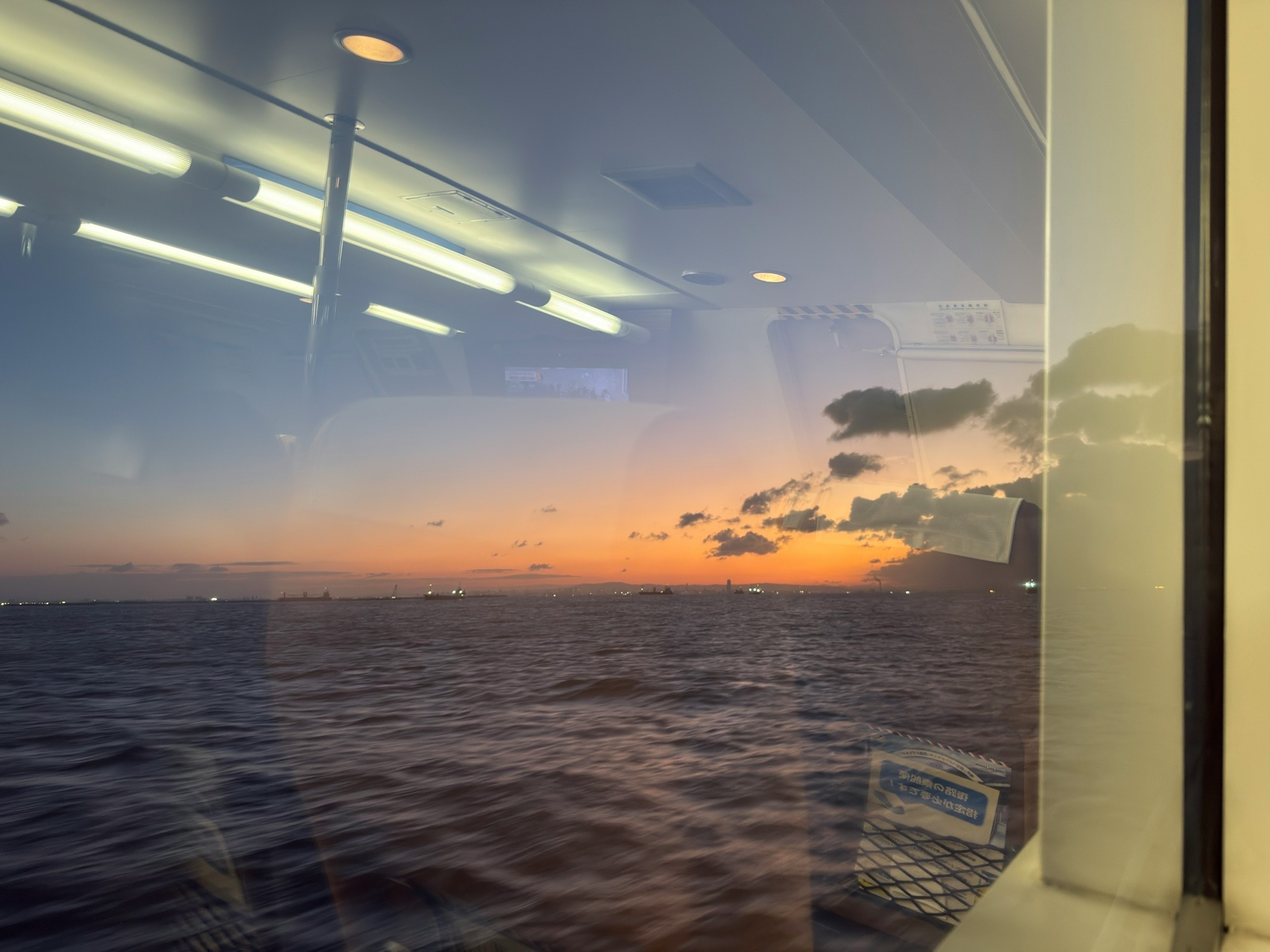 View of sunset and ocean through a window