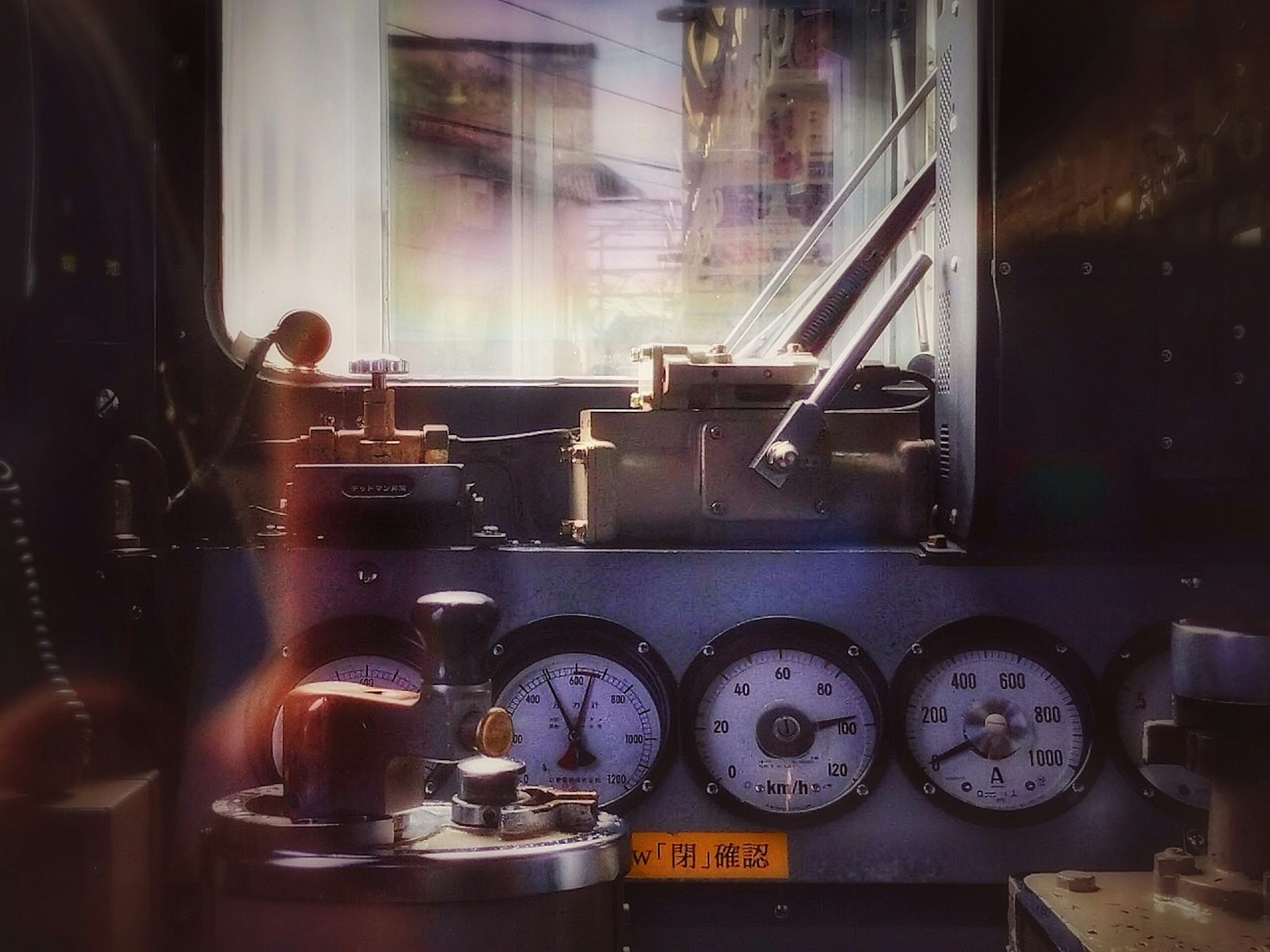 Interior of a control room featuring gauges and levers