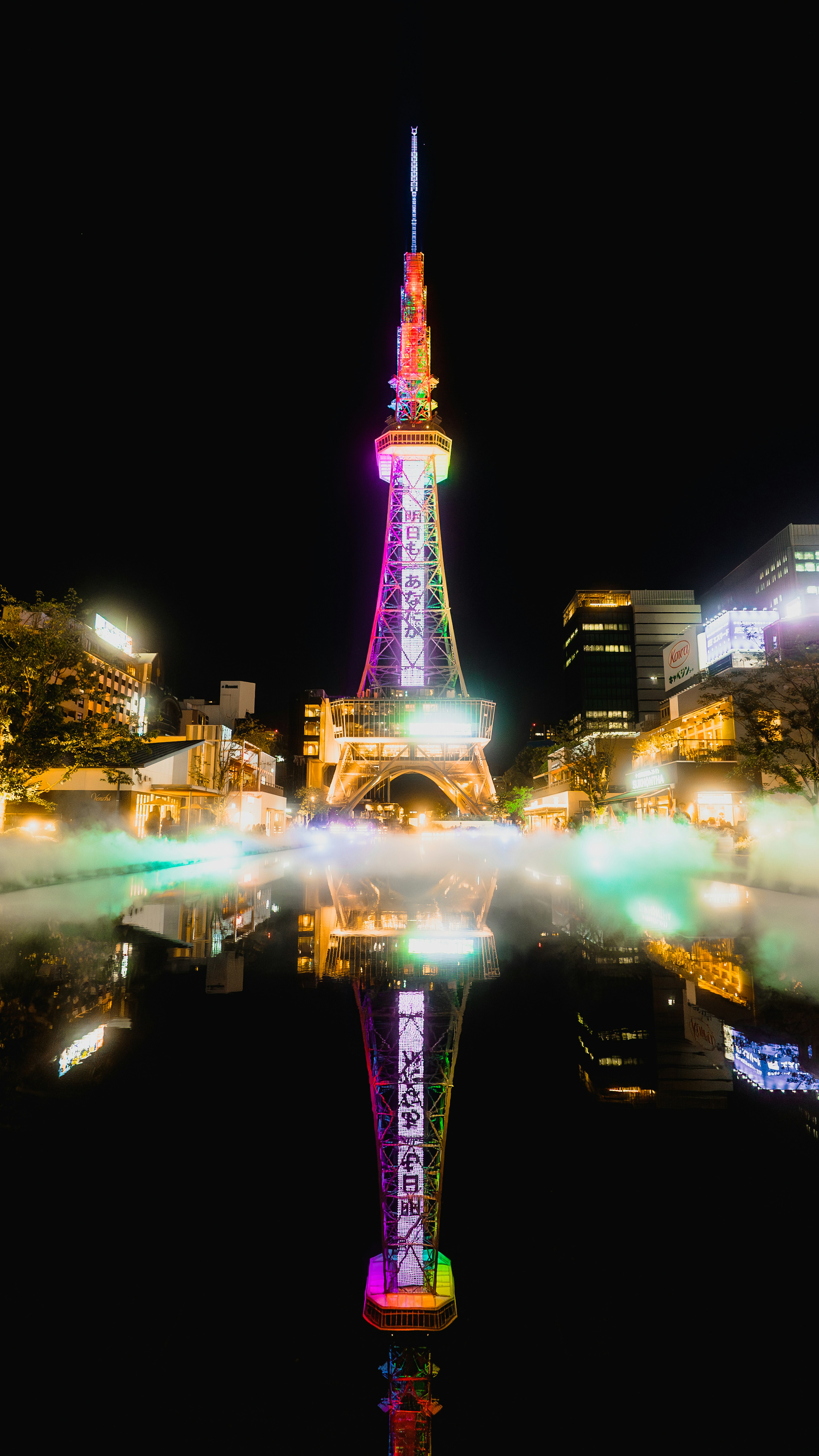 Tokyo Tower illuminated at night with a beautiful reflection on the water