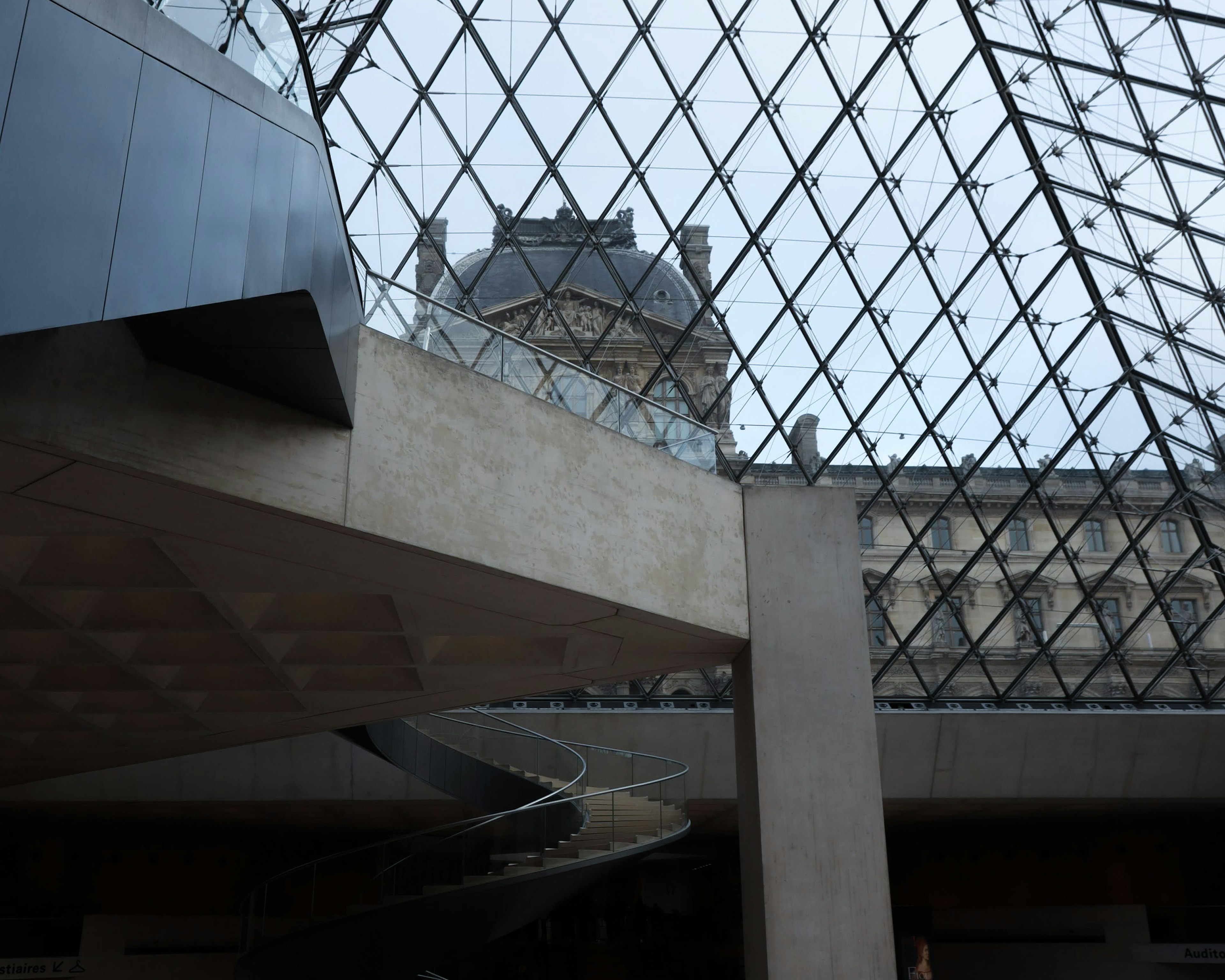 View of the glass roof and a section of the Louvre Museum