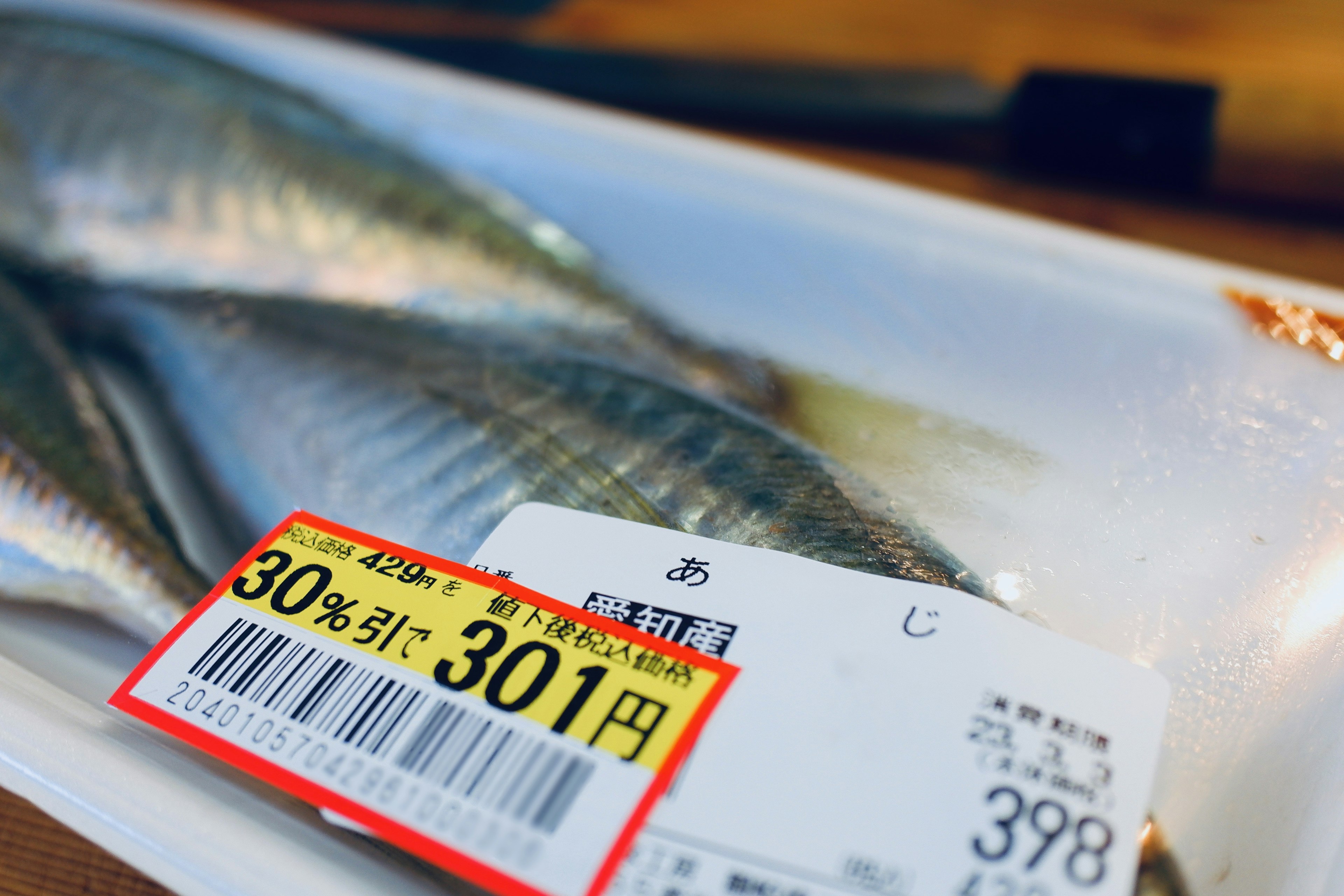 Fish packaging with price tag and discount information