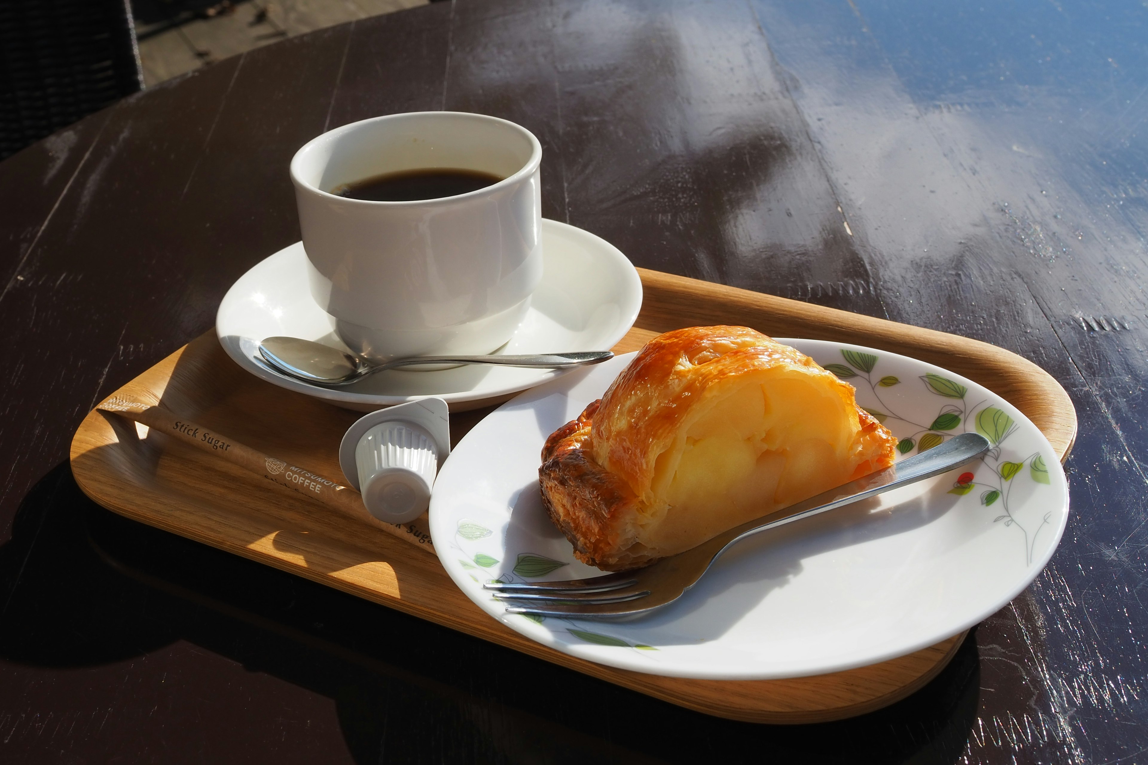 Tray with coffee and pastry