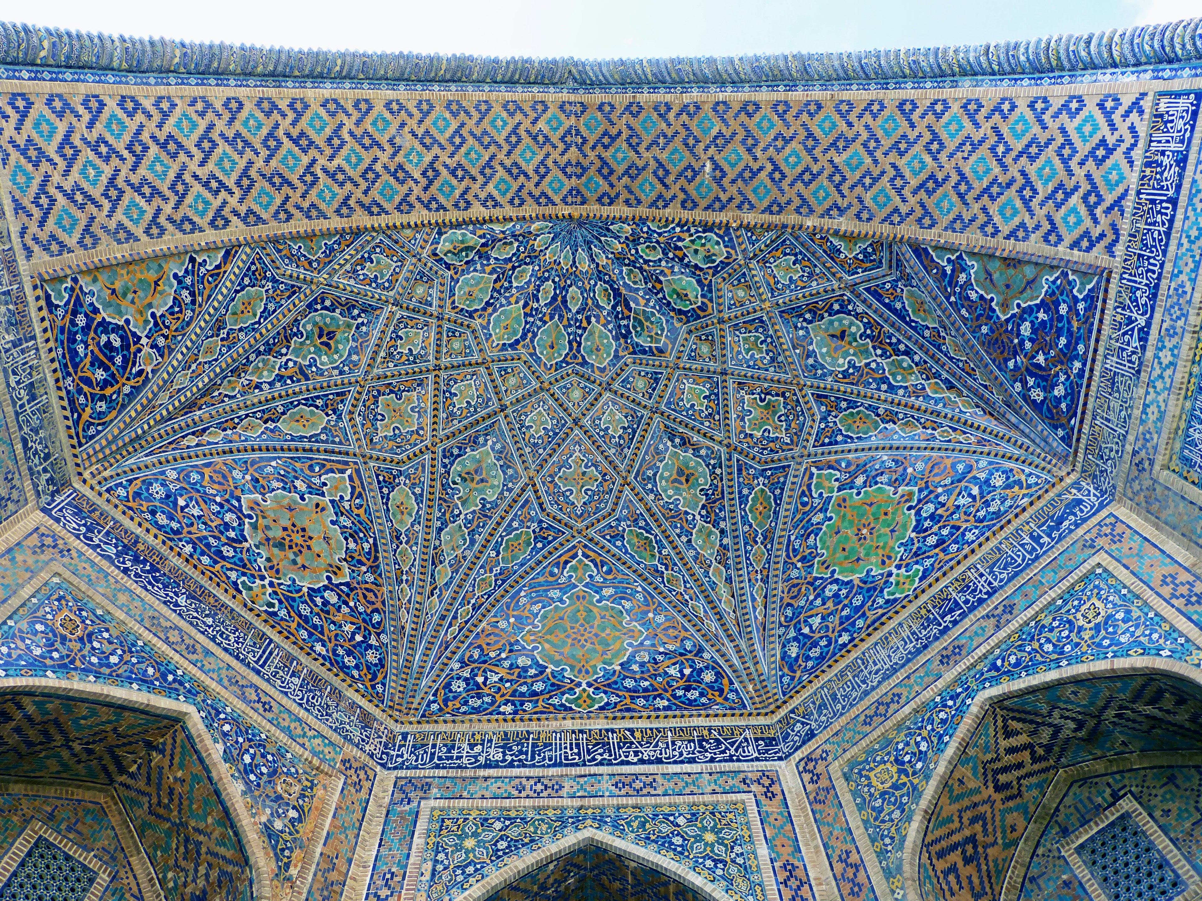 Intricate tile work on the ceiling of a historic mosque