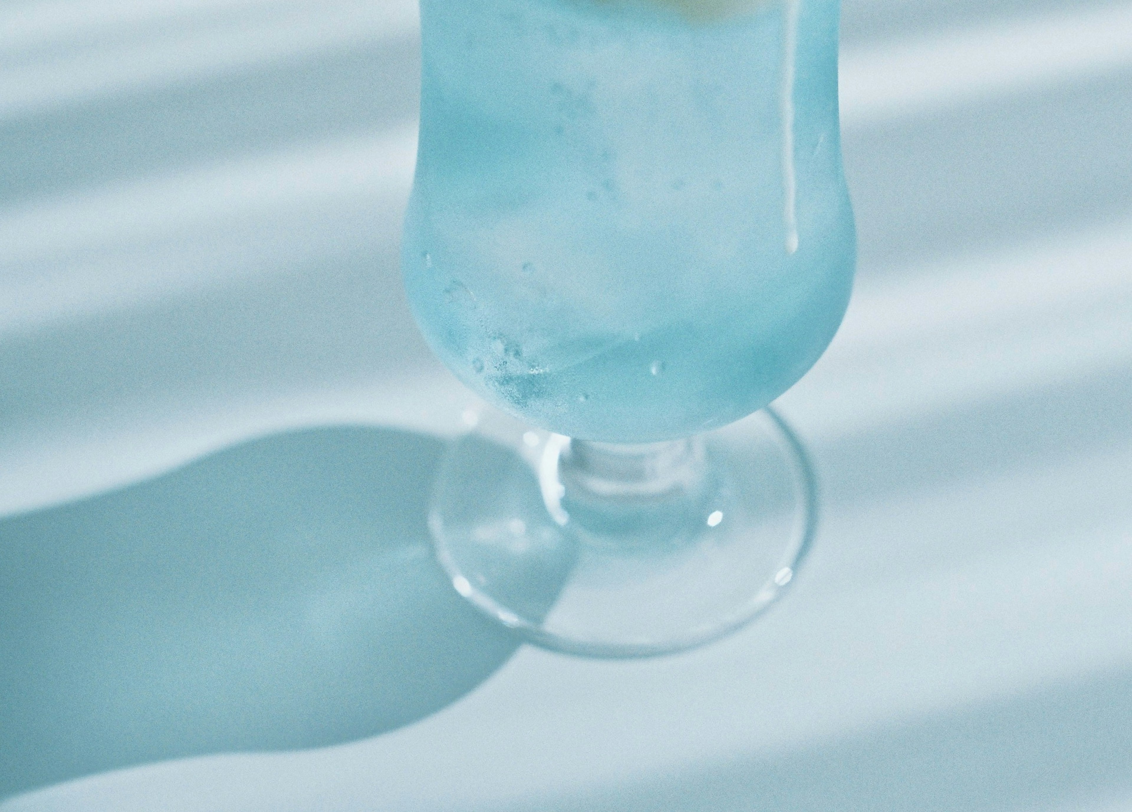 Image of a blue cocktail in a glass