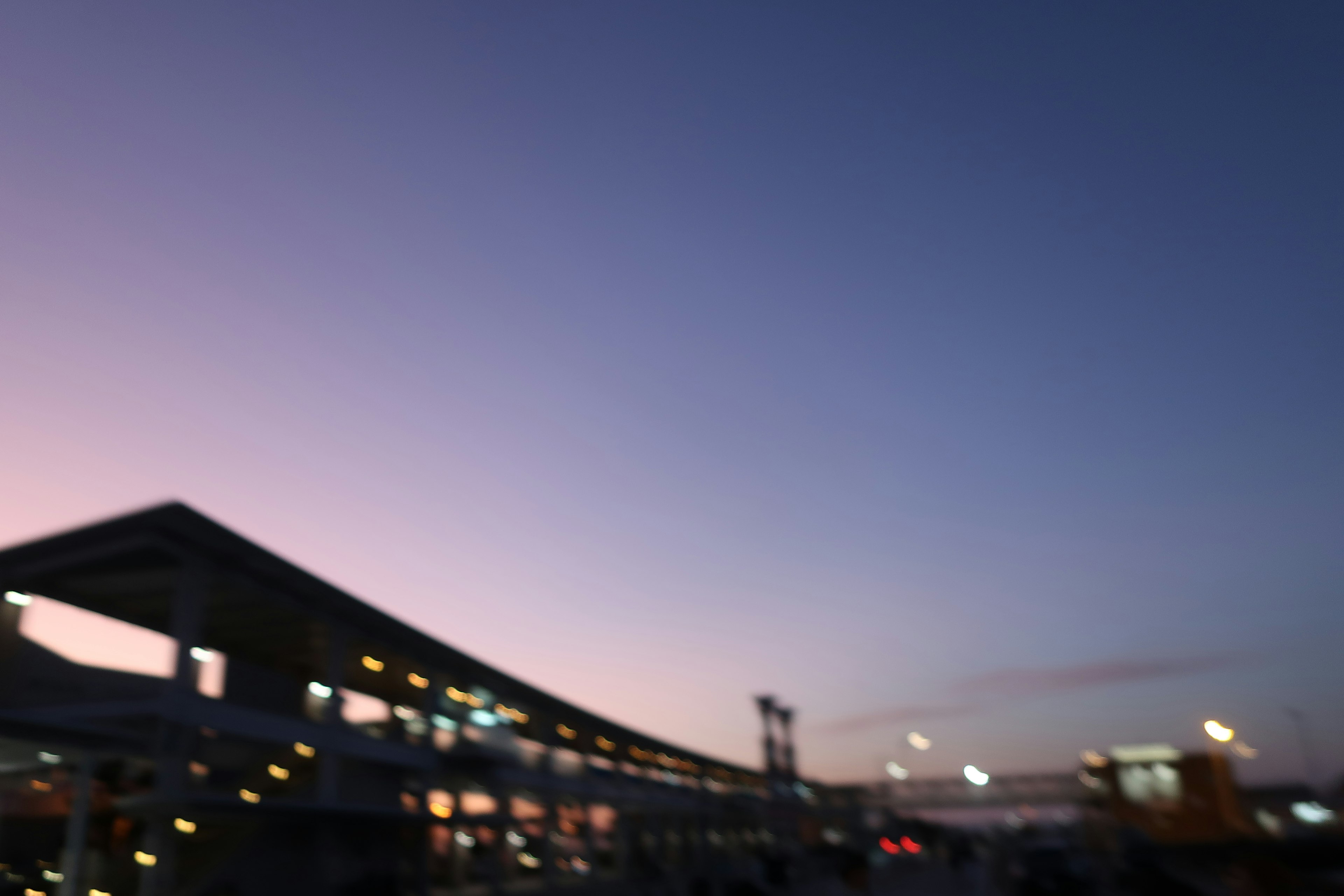 Twilight scene with blue-purple sky and silhouette of buildings