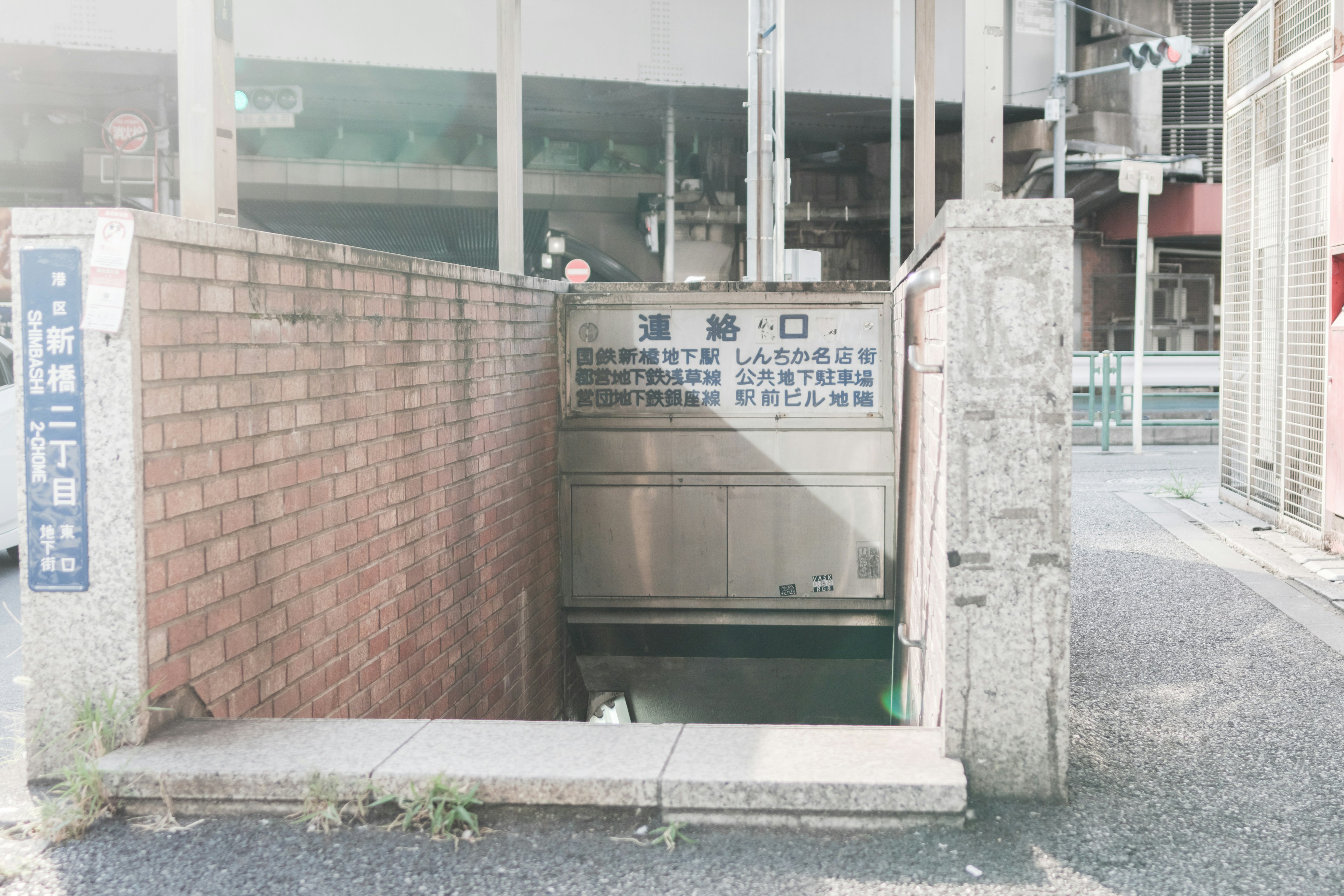 Street corner featuring an entrance to an underground passage