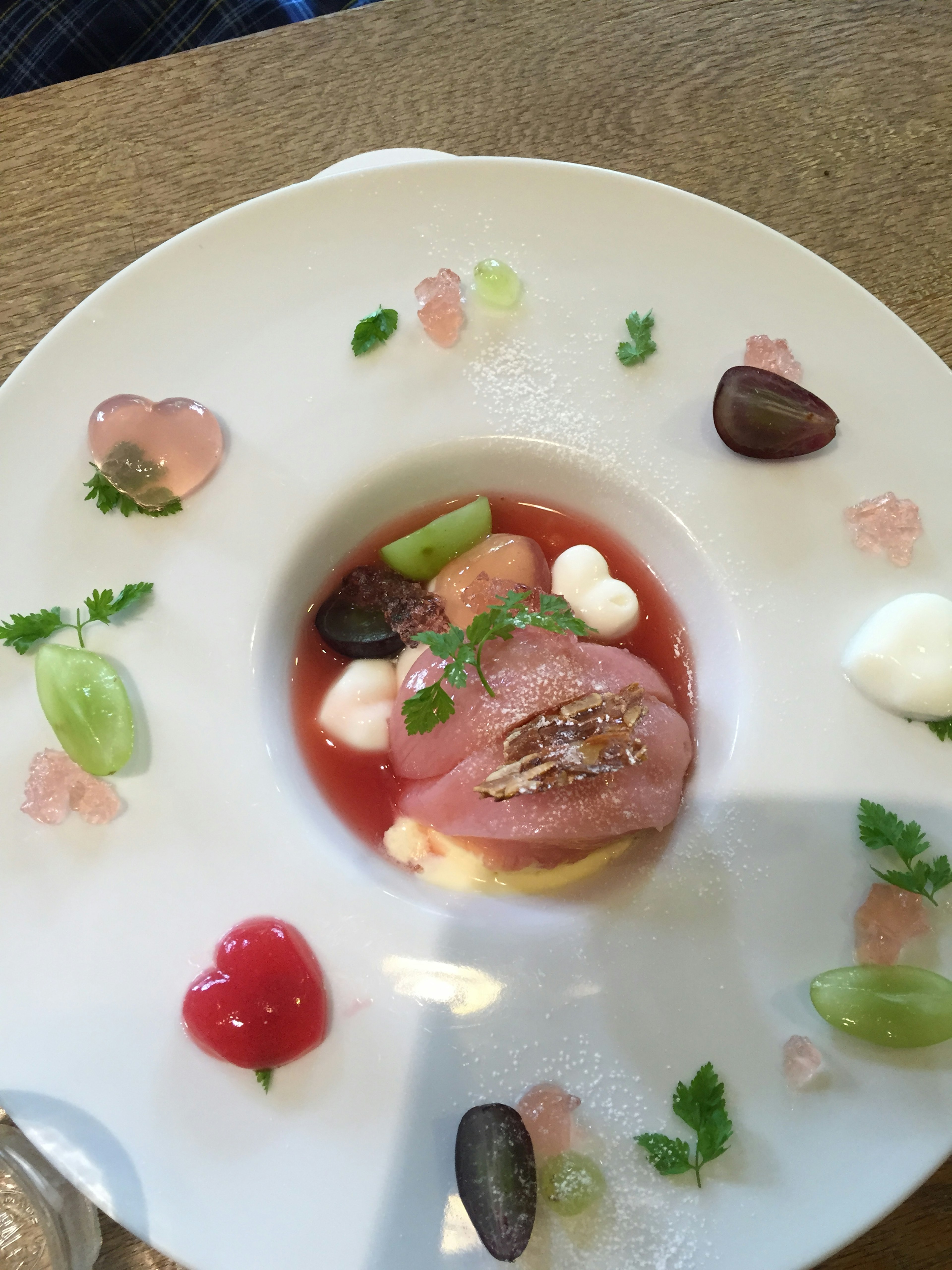 A beautifully arranged dish with colorful ingredients presented artfully on a plate