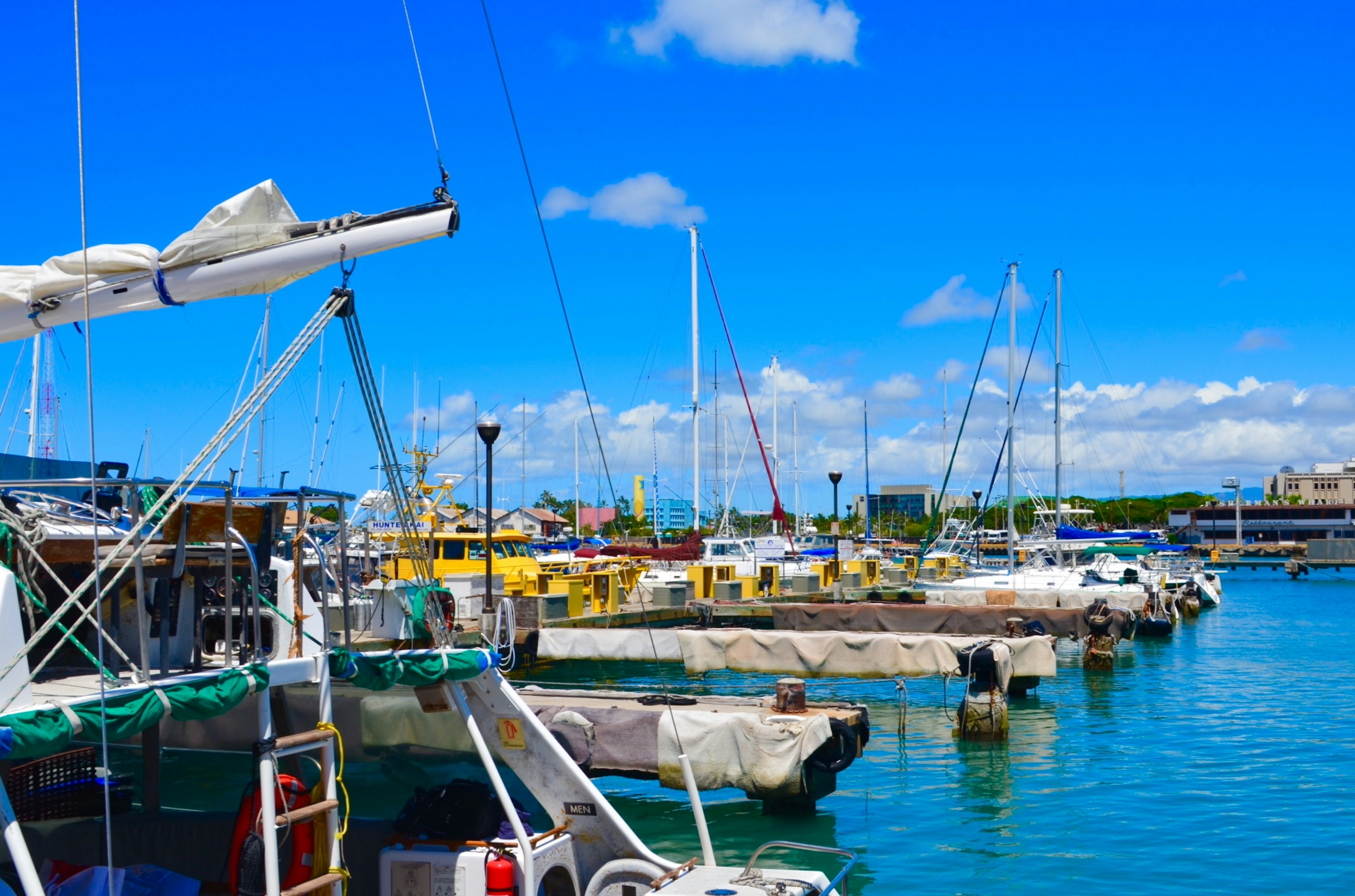 Harbor scene with boats and clear blue sky