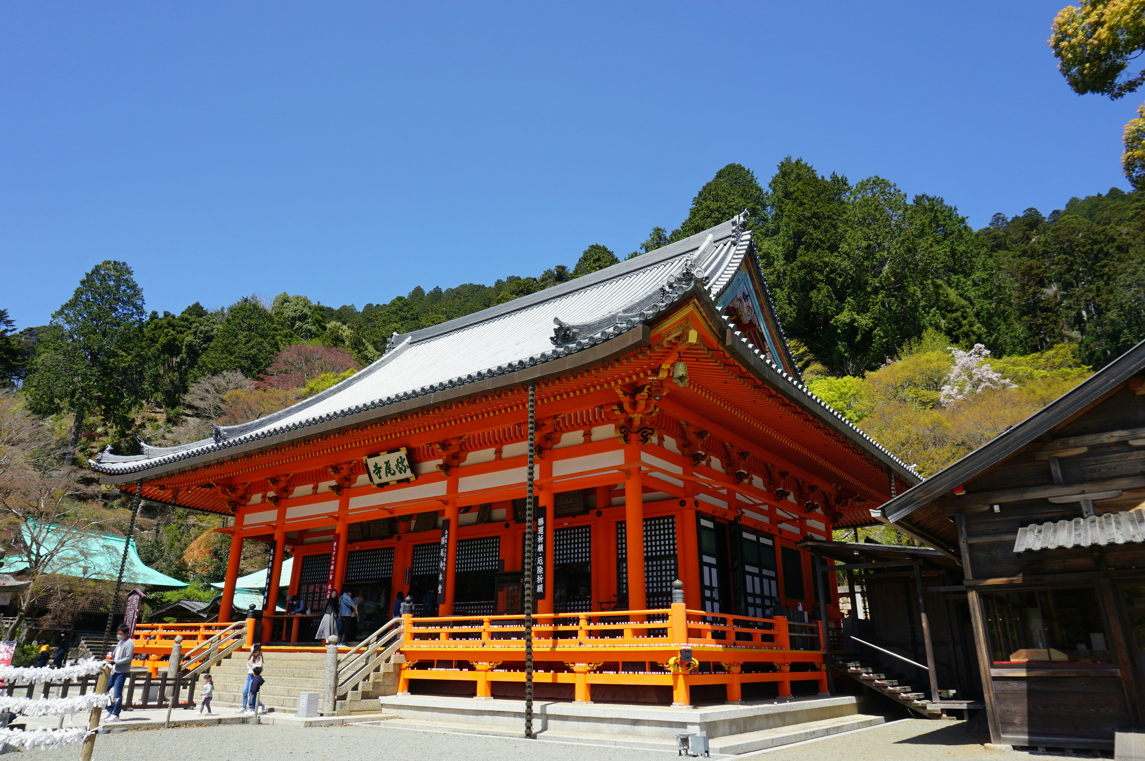 A beautiful orange shrine building under a blue sky