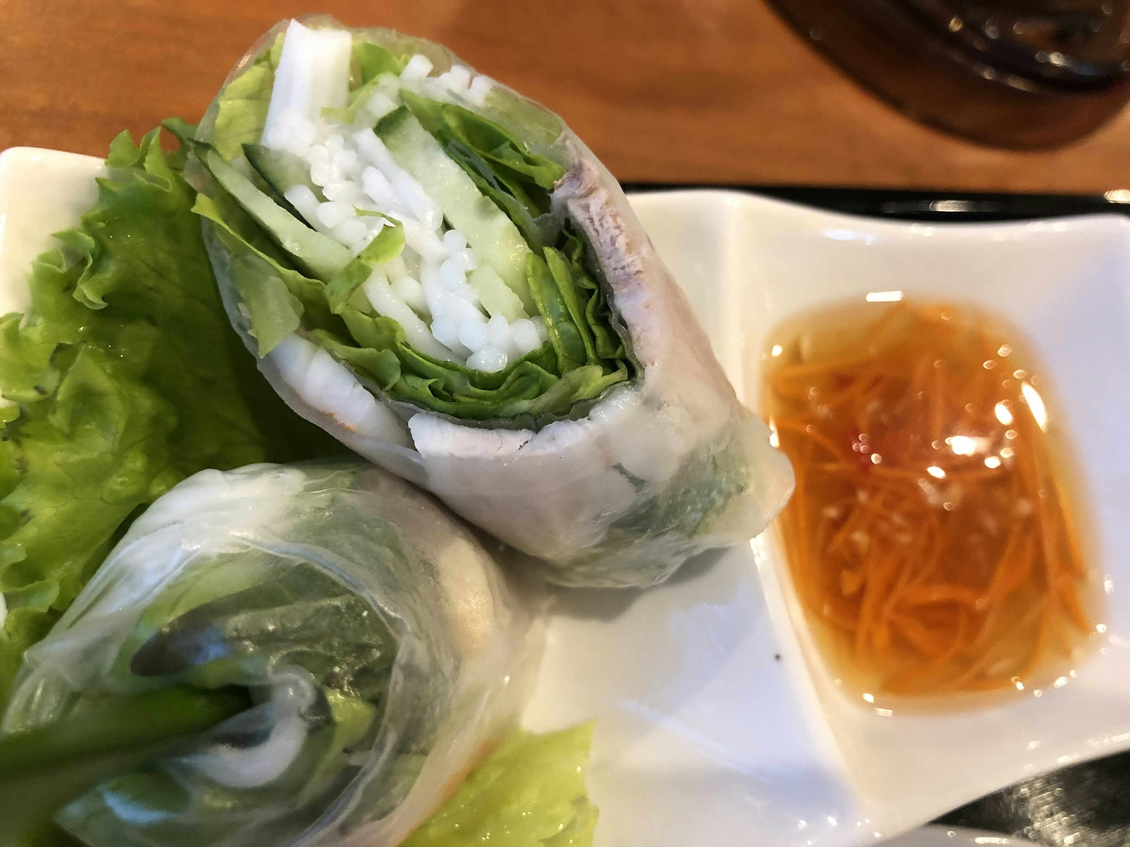 Plate of fresh spring rolls with a sweet and sour sauce