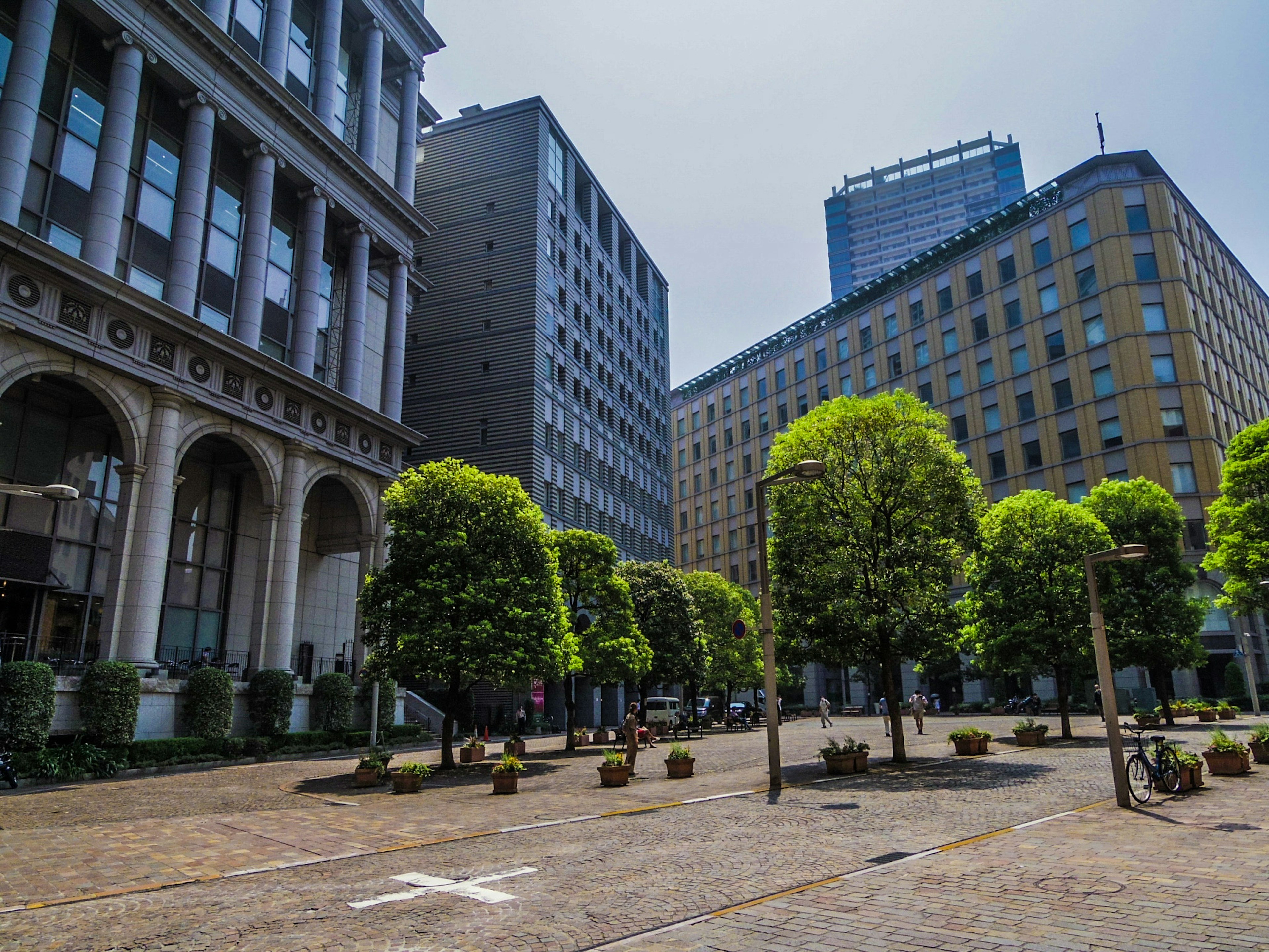 Urban green square with surrounding high-rise buildings