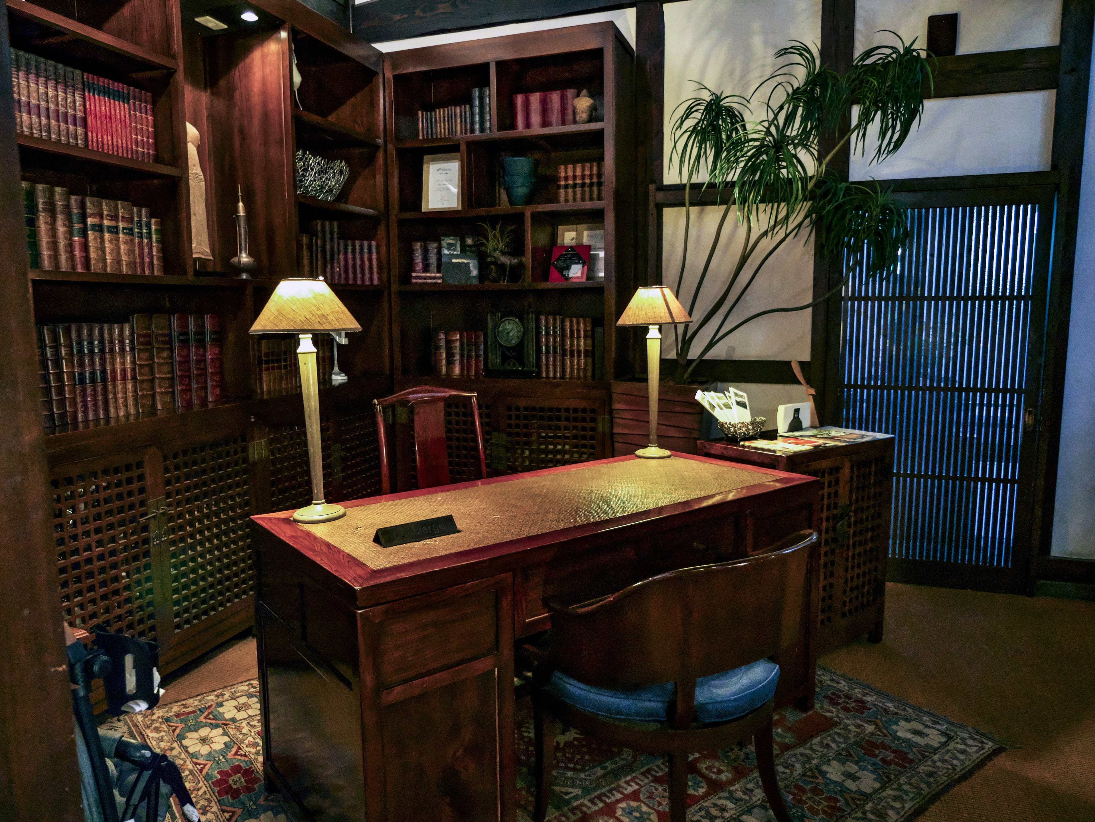 Cozy study with wooden bookshelves and desk