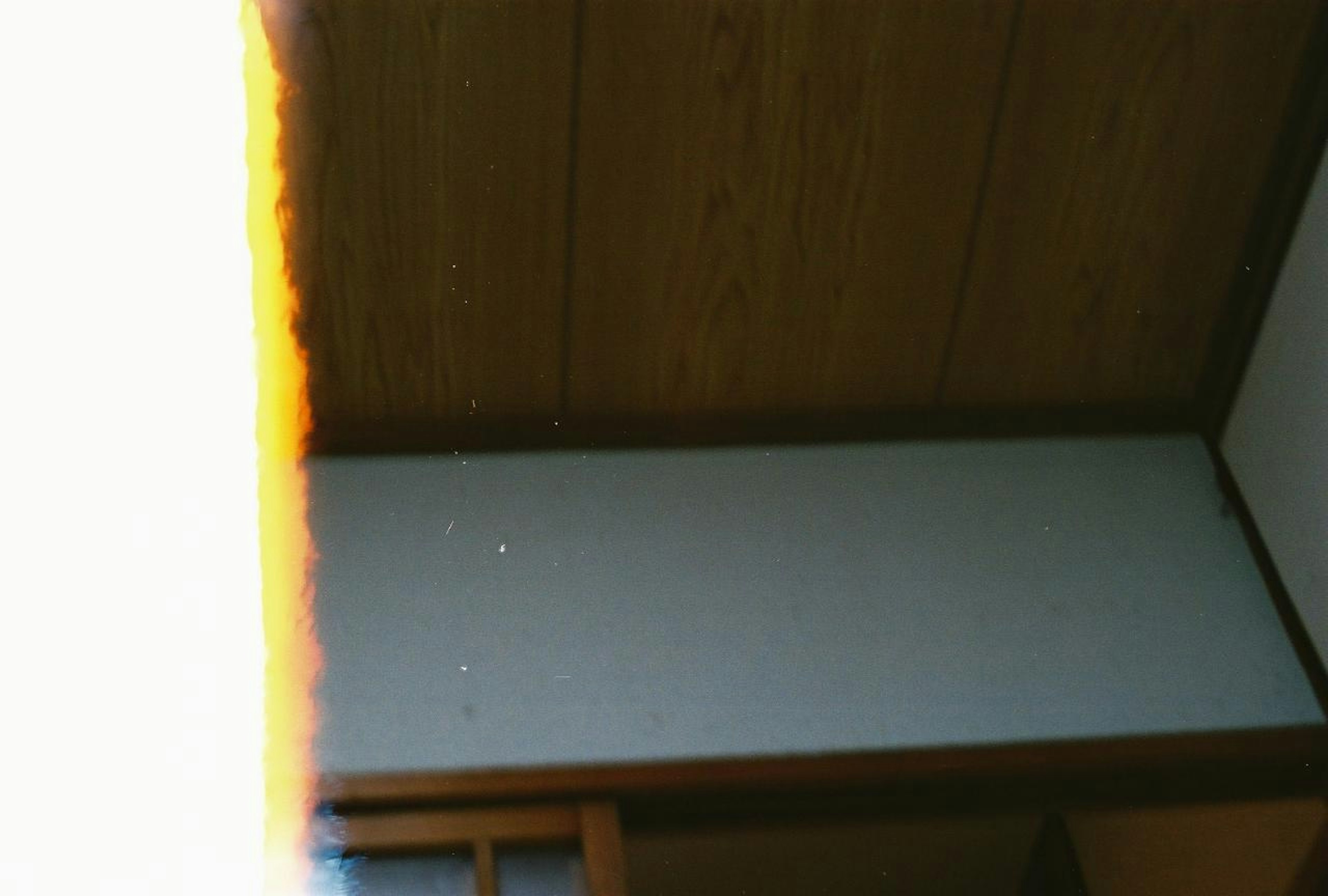 Image of an interior room showing ceiling and part of a white wall