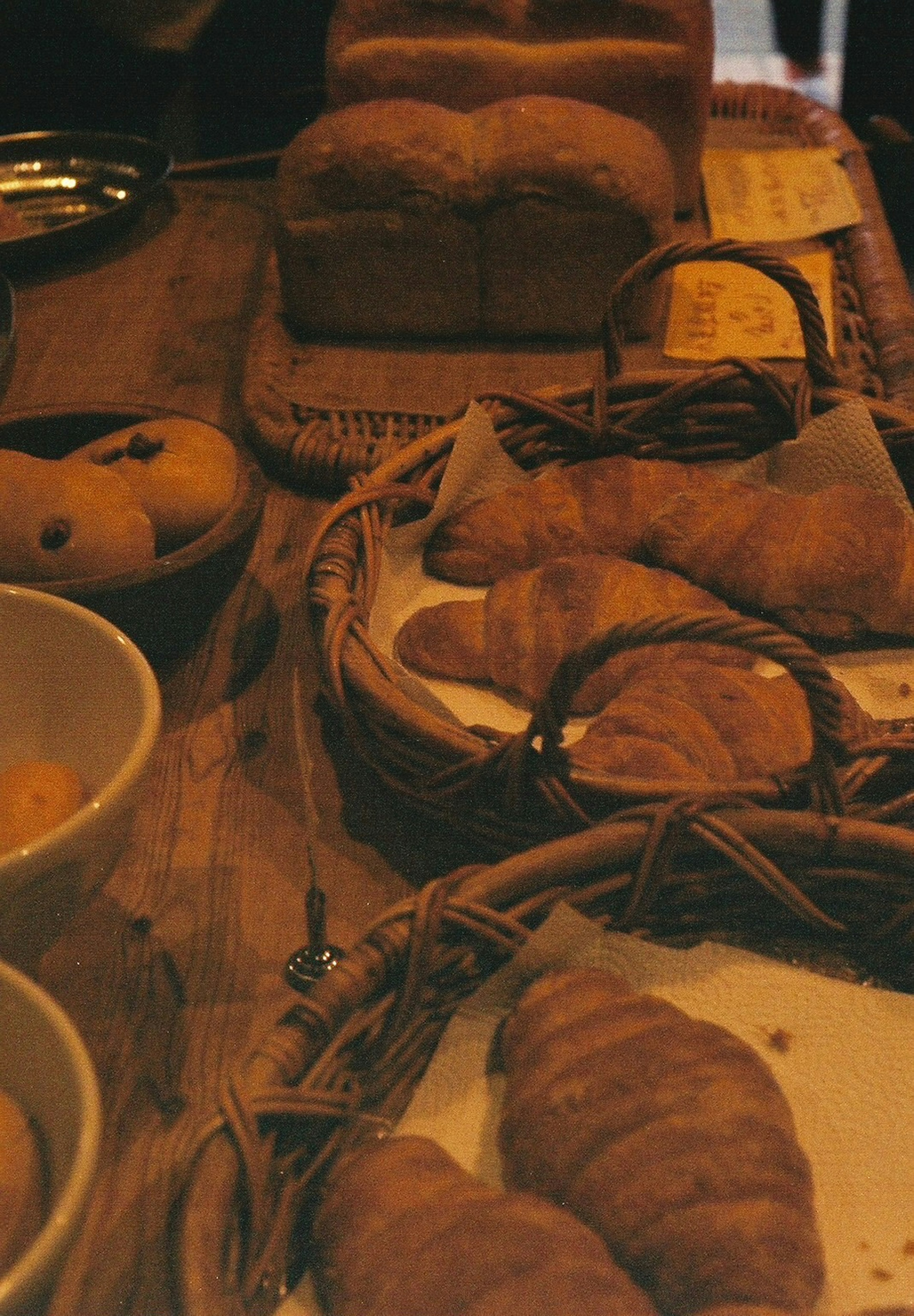 Freshly baked bread and croissants displayed on a table