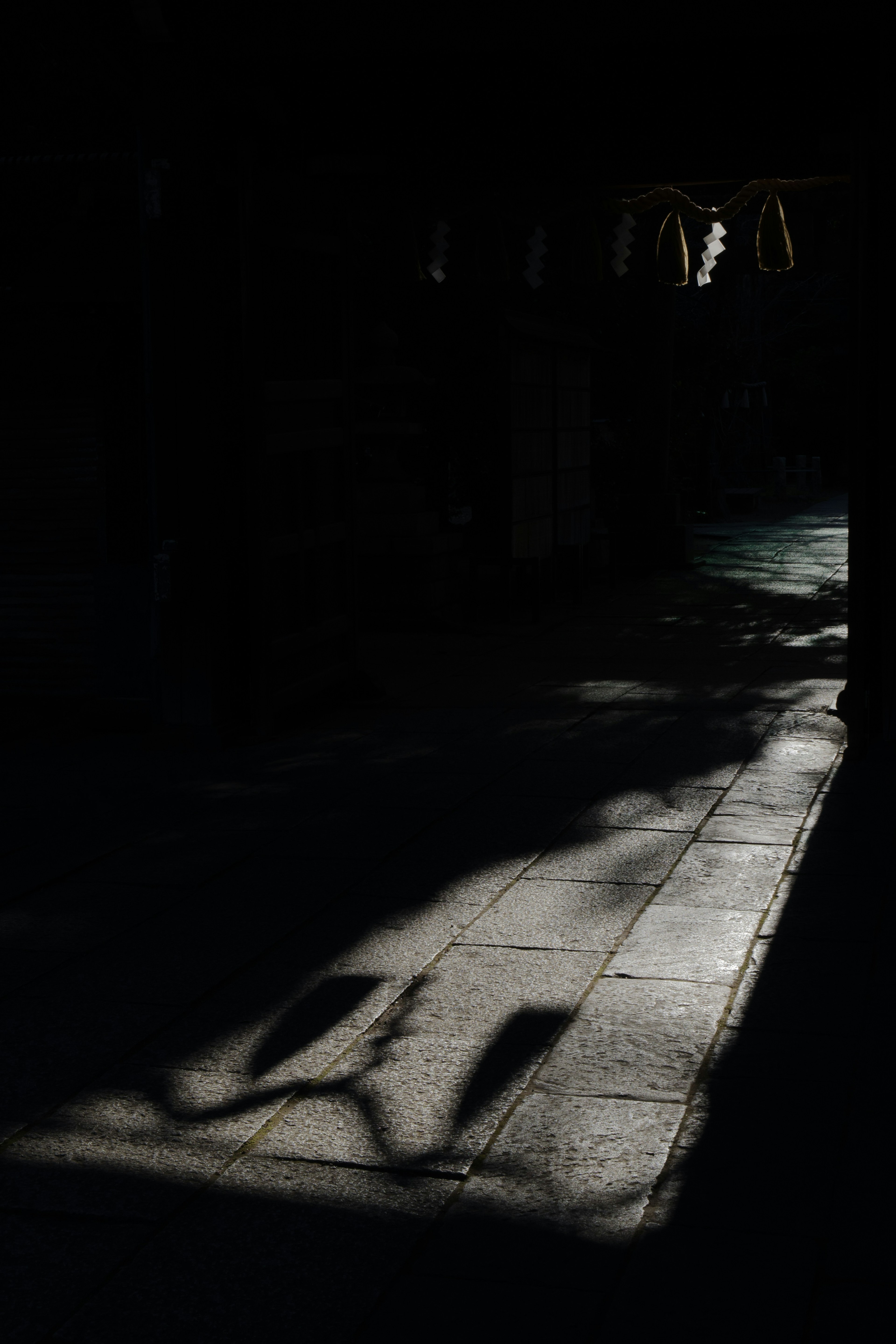 Contrast of shadows and light on a dark corridor