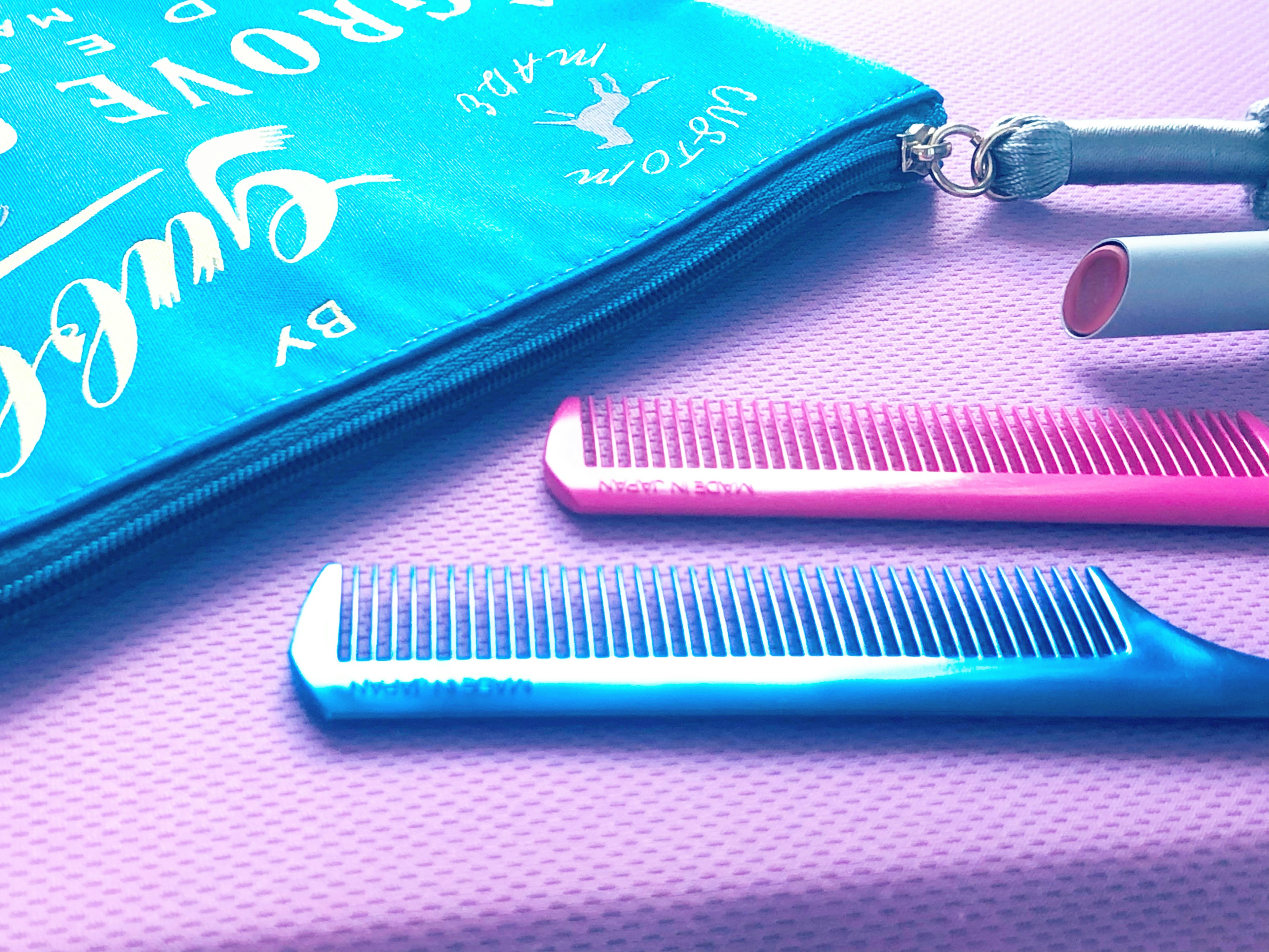 Image featuring a blue pouch and blue and pink combs