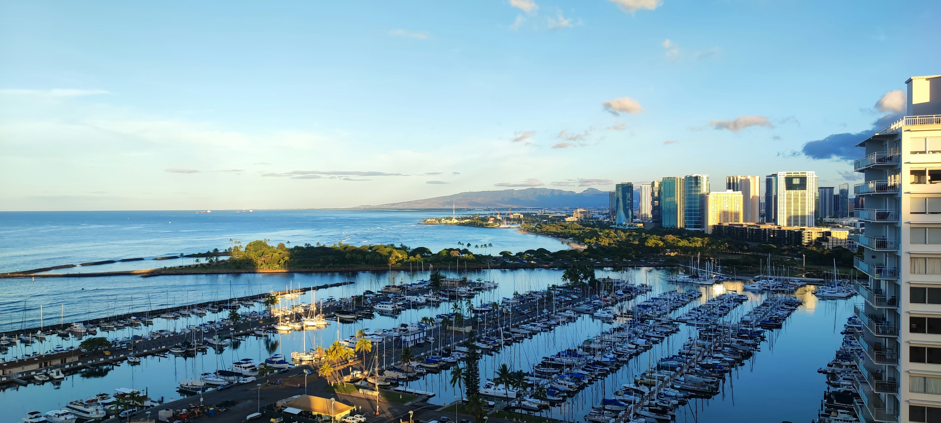 Panoramic view of Honolulu harbor with blue ocean and skyline