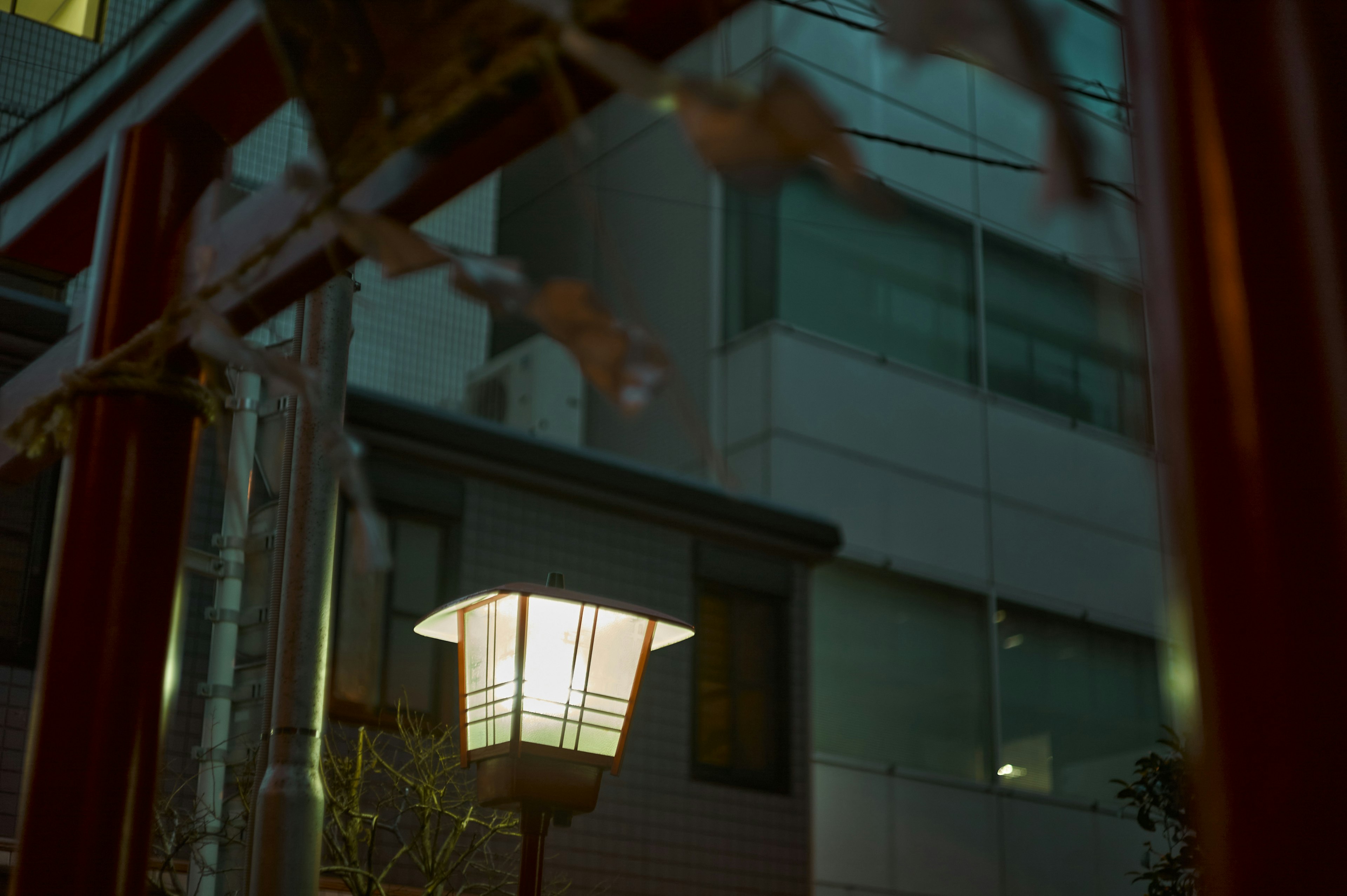 Night cityscape with glowing lantern