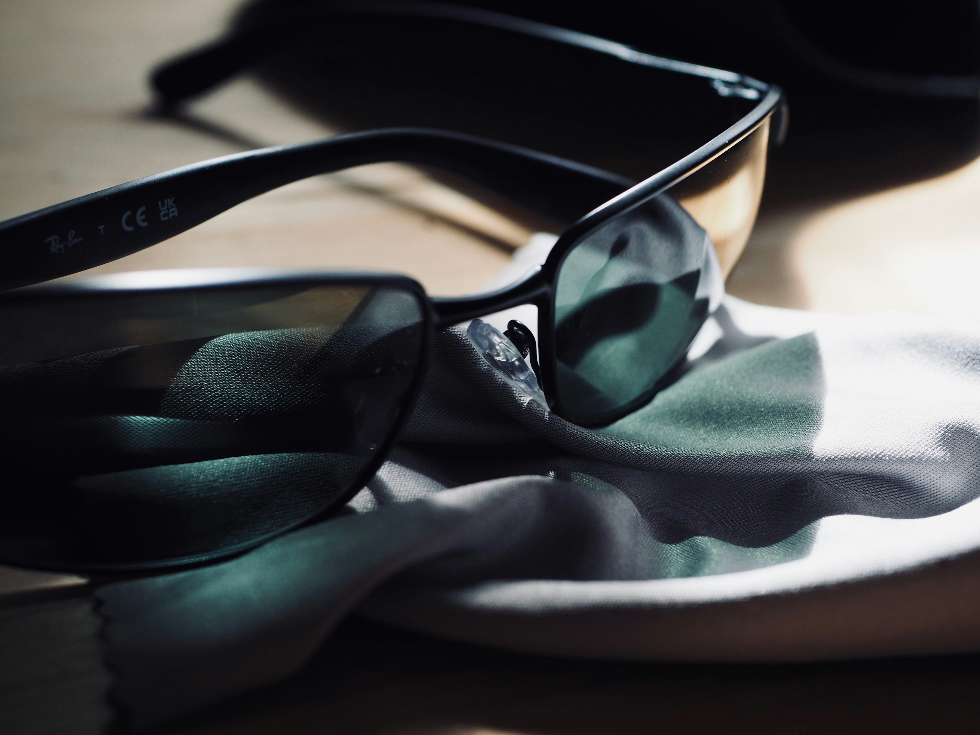 Close-up of sunglasses resting on a cloth