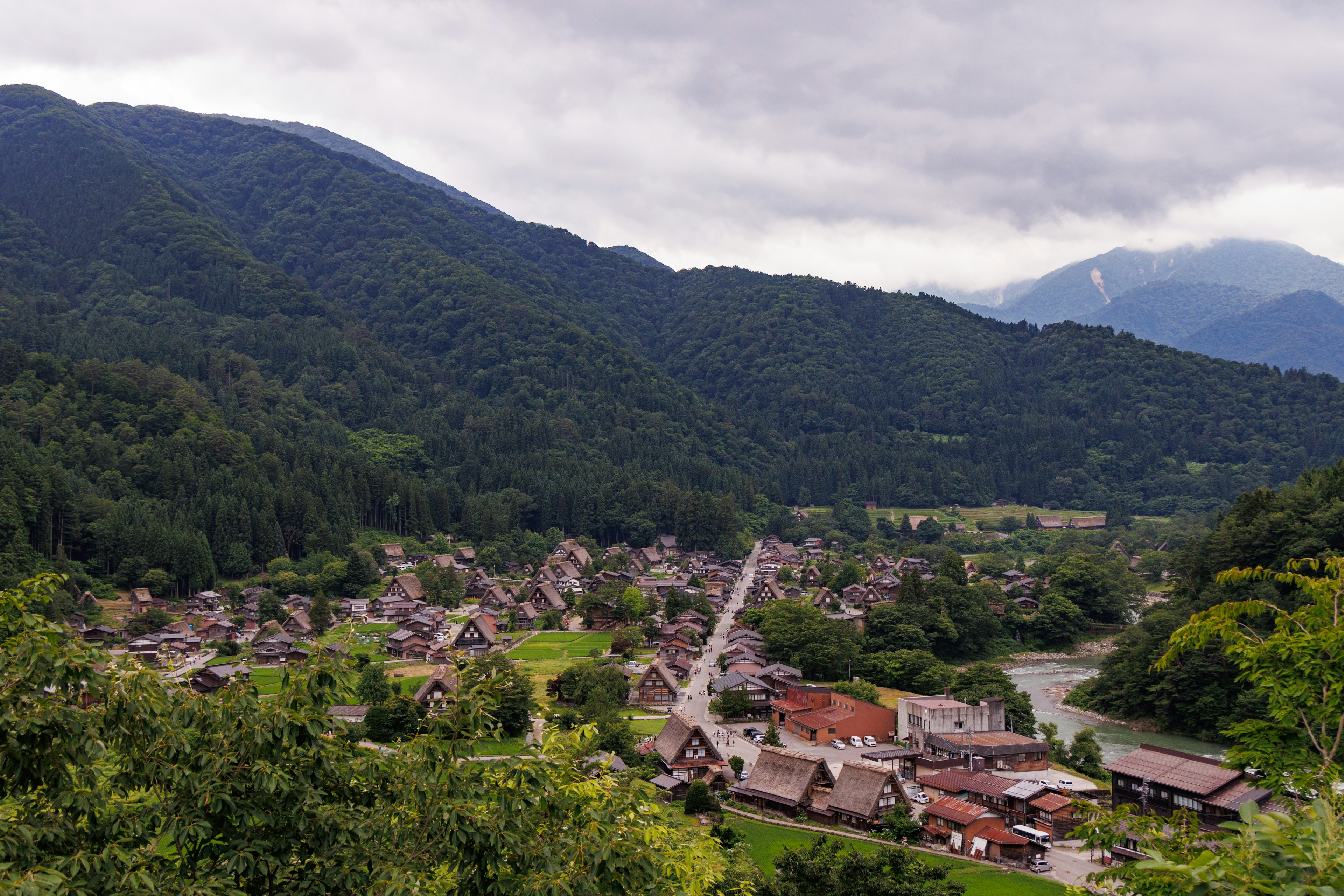 Scenic village surrounded by mountains with traditional houses