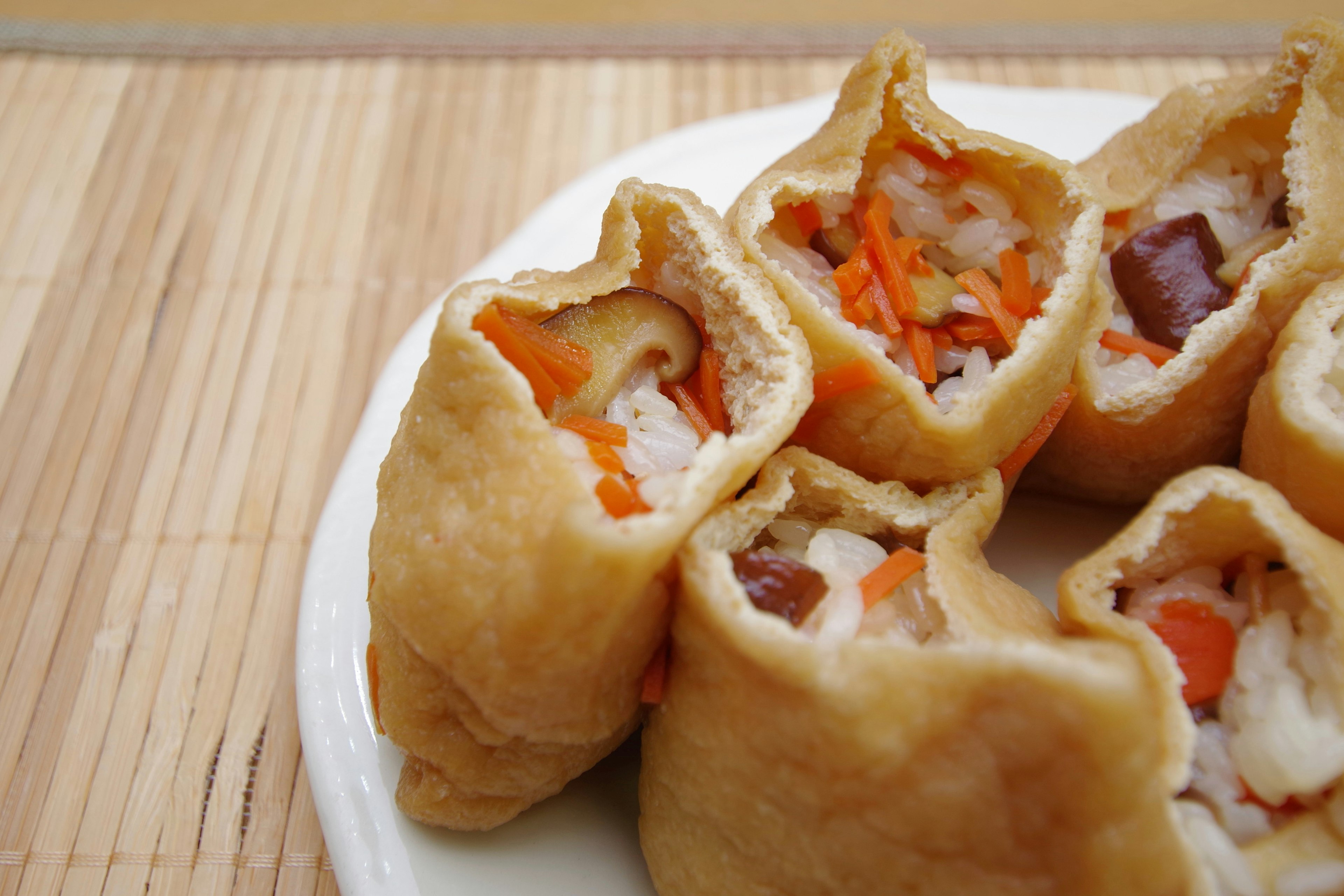 Fried tofu pockets filled with rice and vegetables