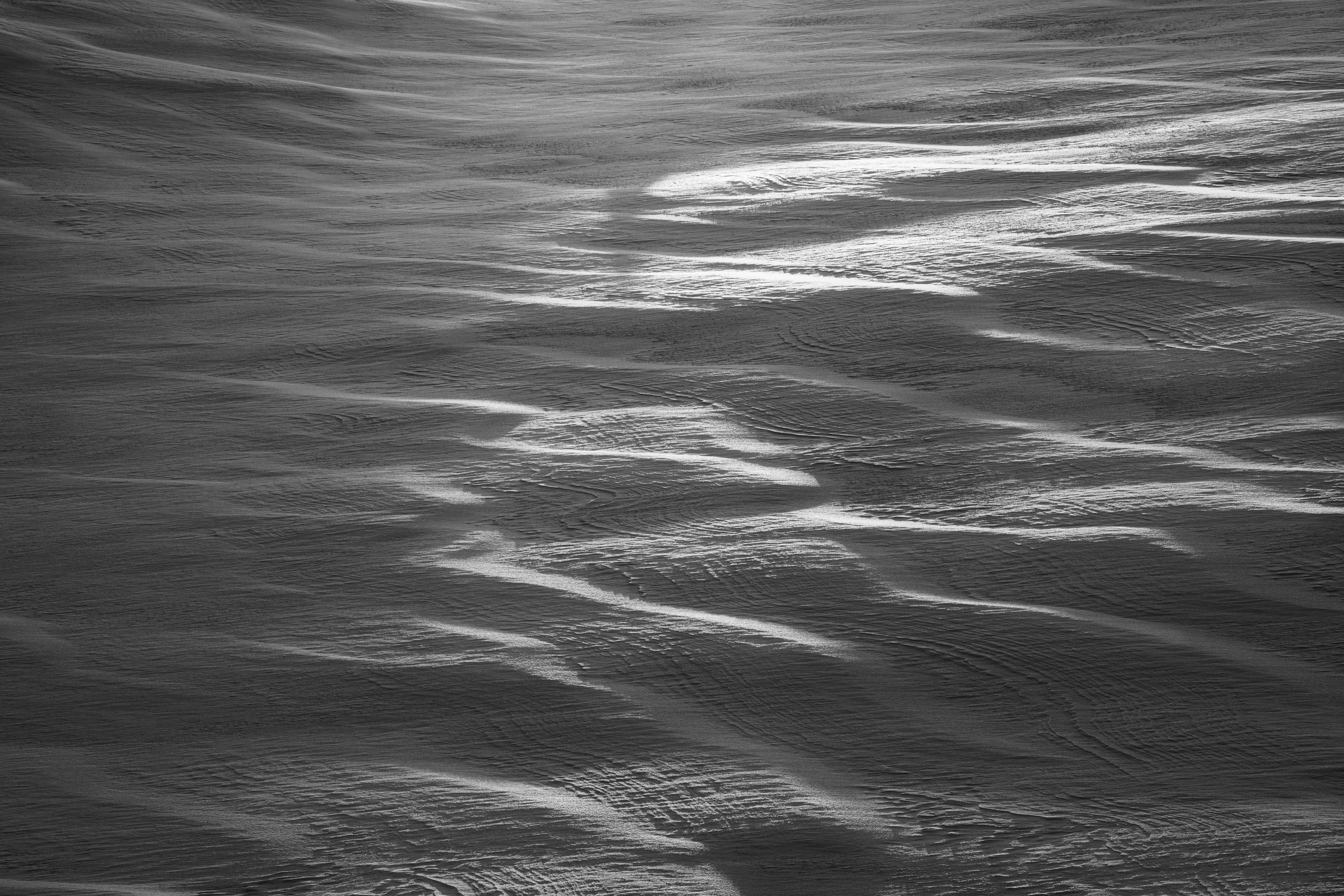 Detailed surface of water with ripples in black and white