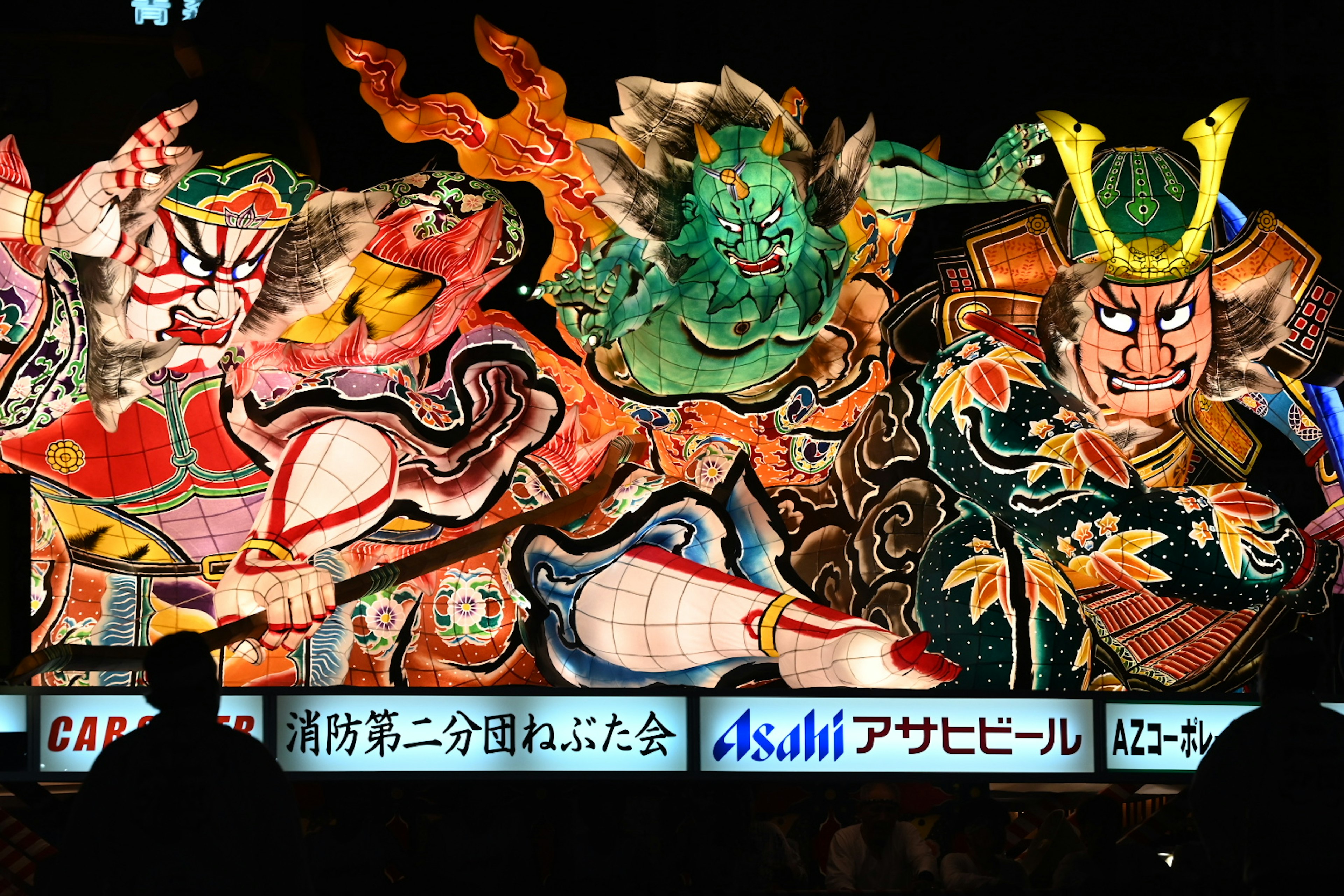 Colorful traditional Japanese festival float featuring demons and samurai characters