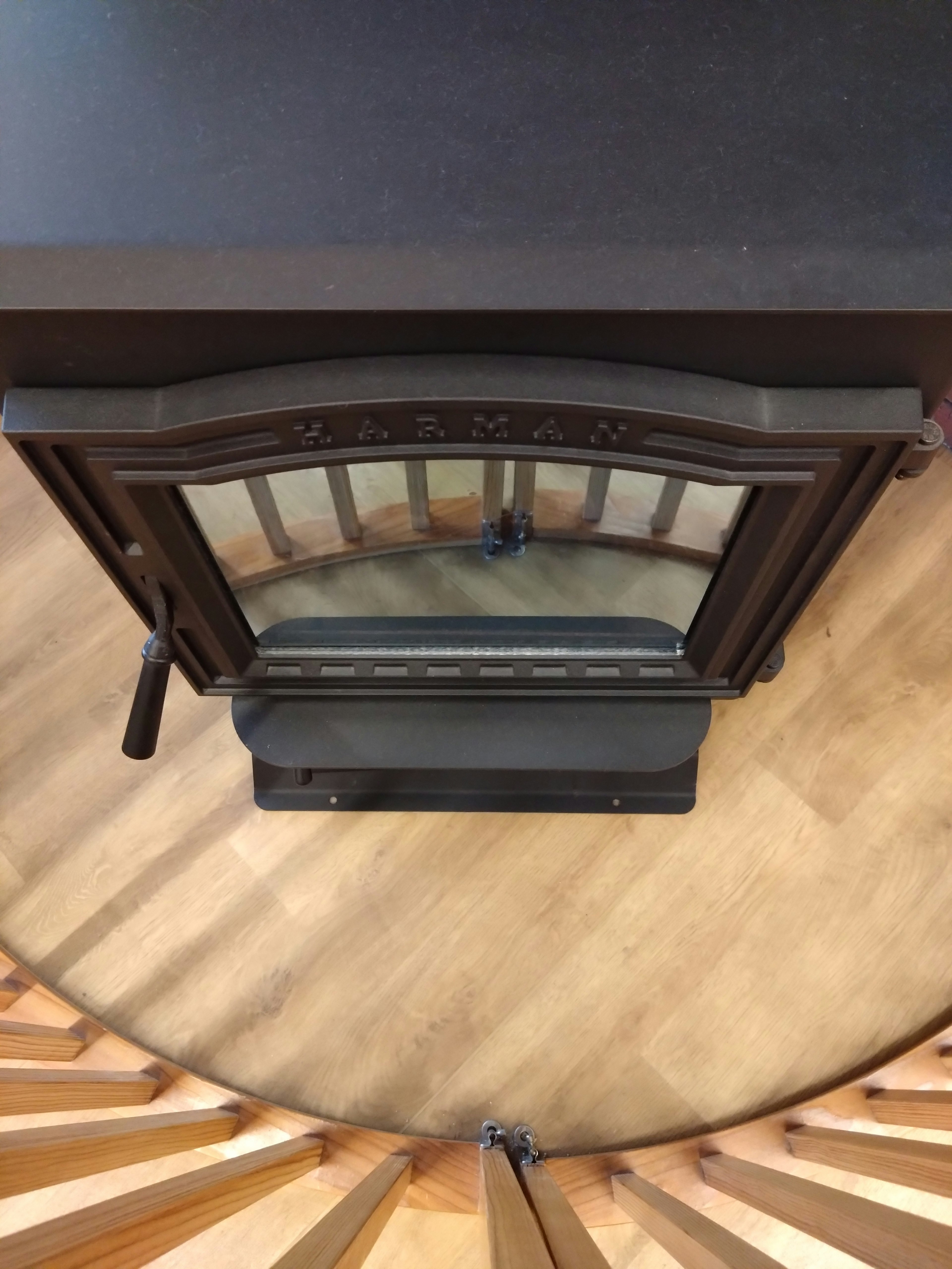 Top view of a fireplace design with a metal handle