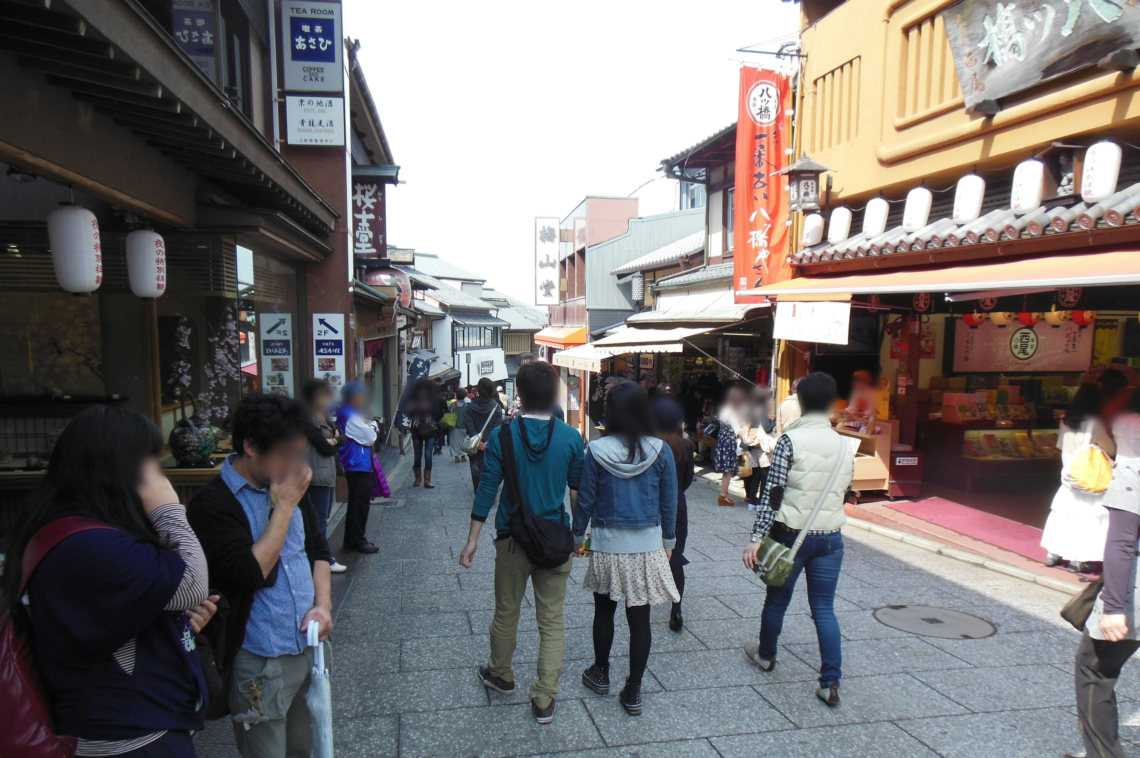 Bustling street with people and traditional buildings