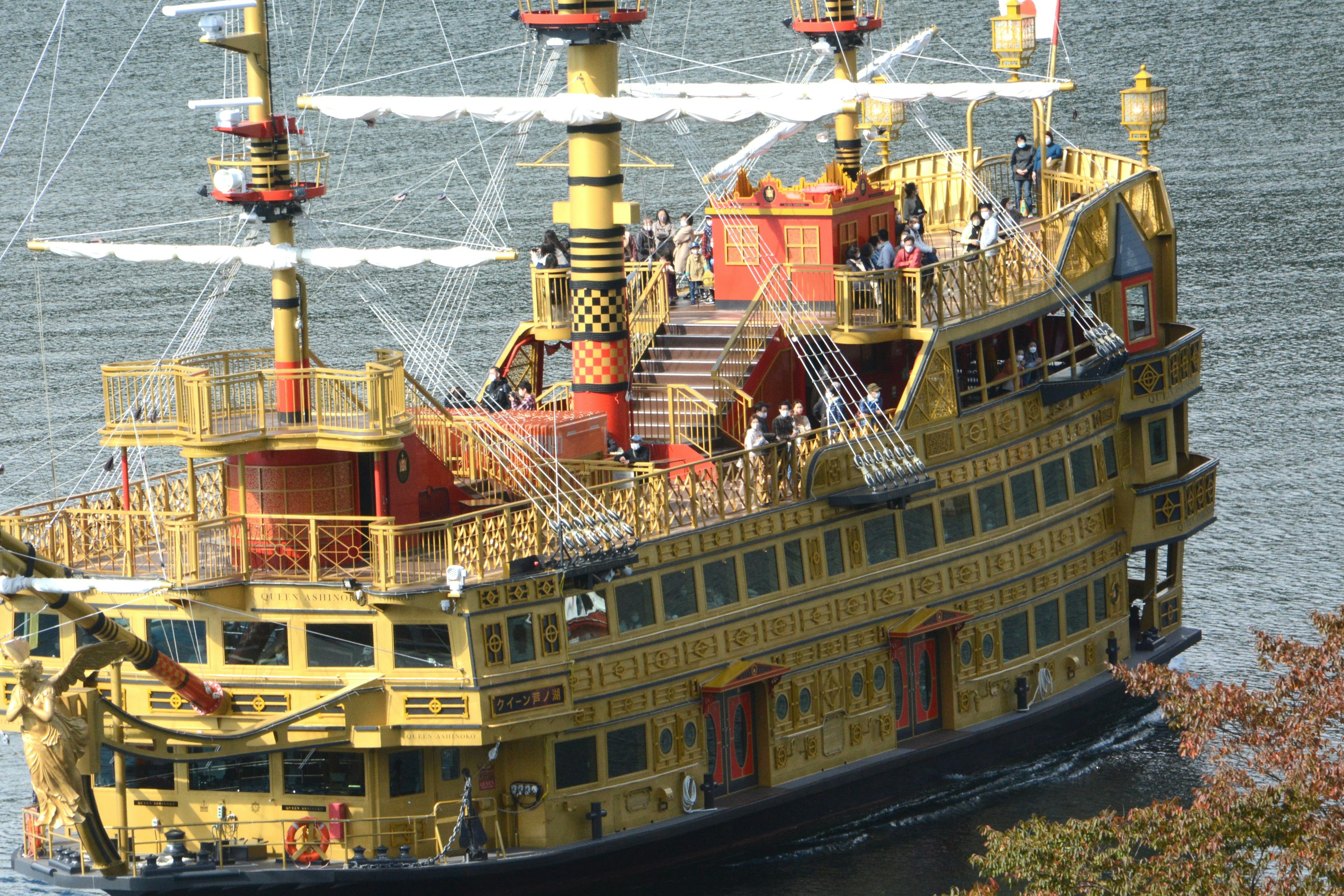 A beautiful golden pirate ship sailing on the water