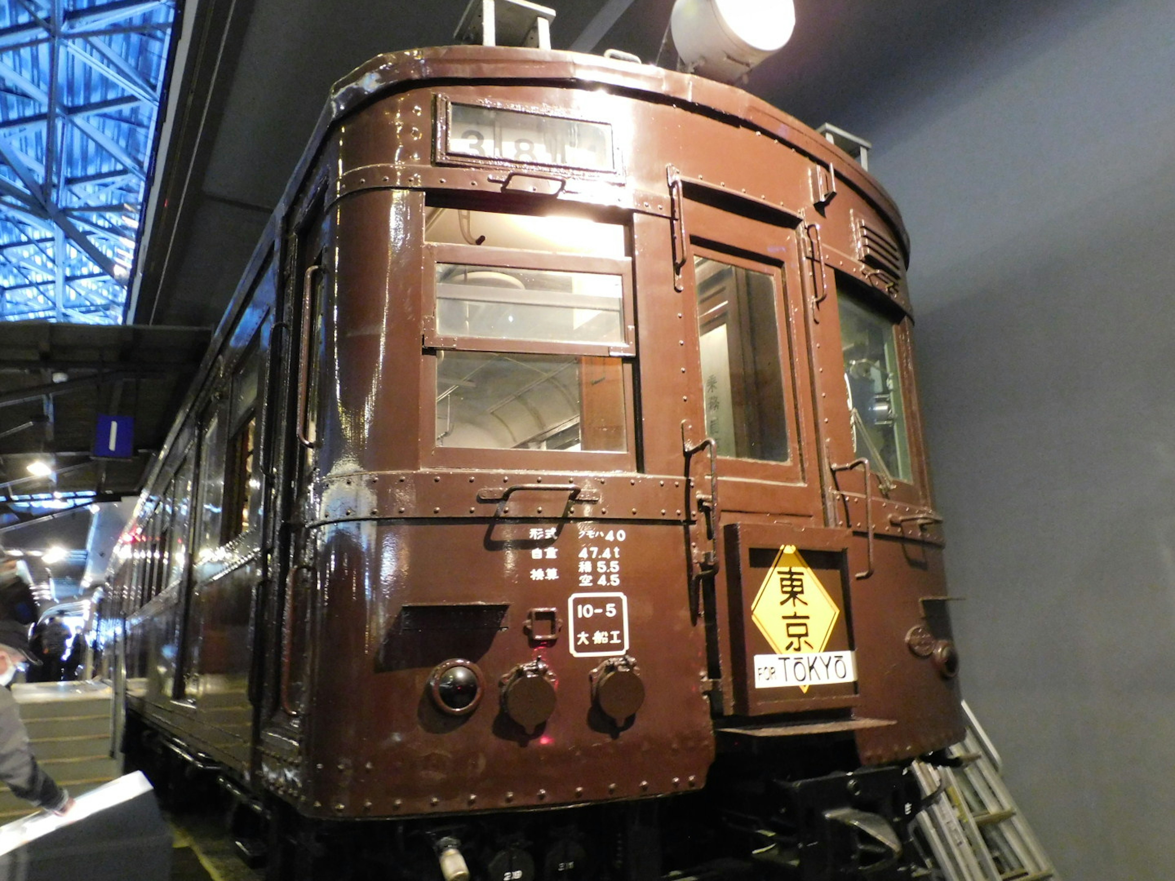 Image of the rear of a vintage brown train on display