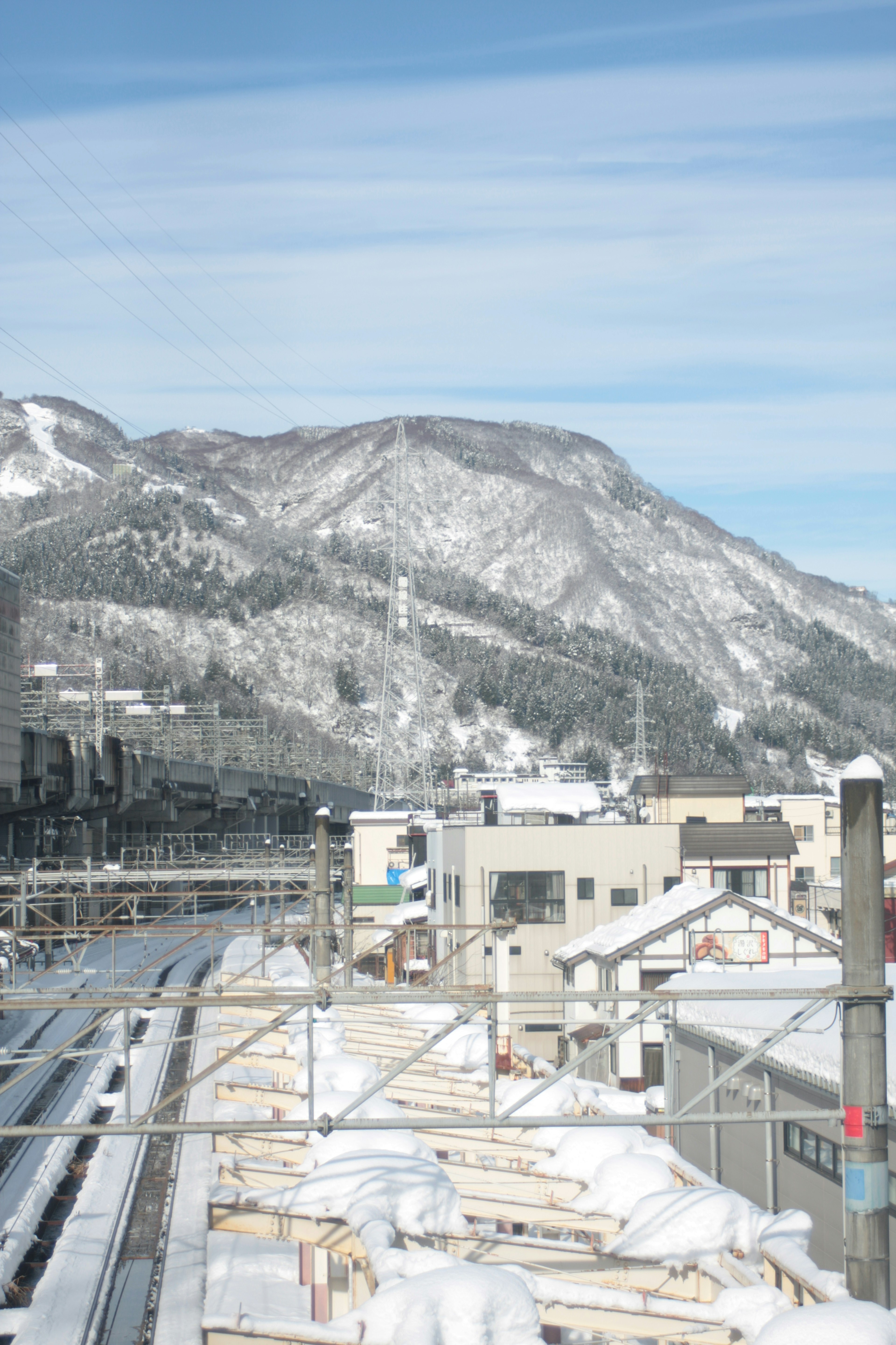 Snow-covered mountain and cityscape view