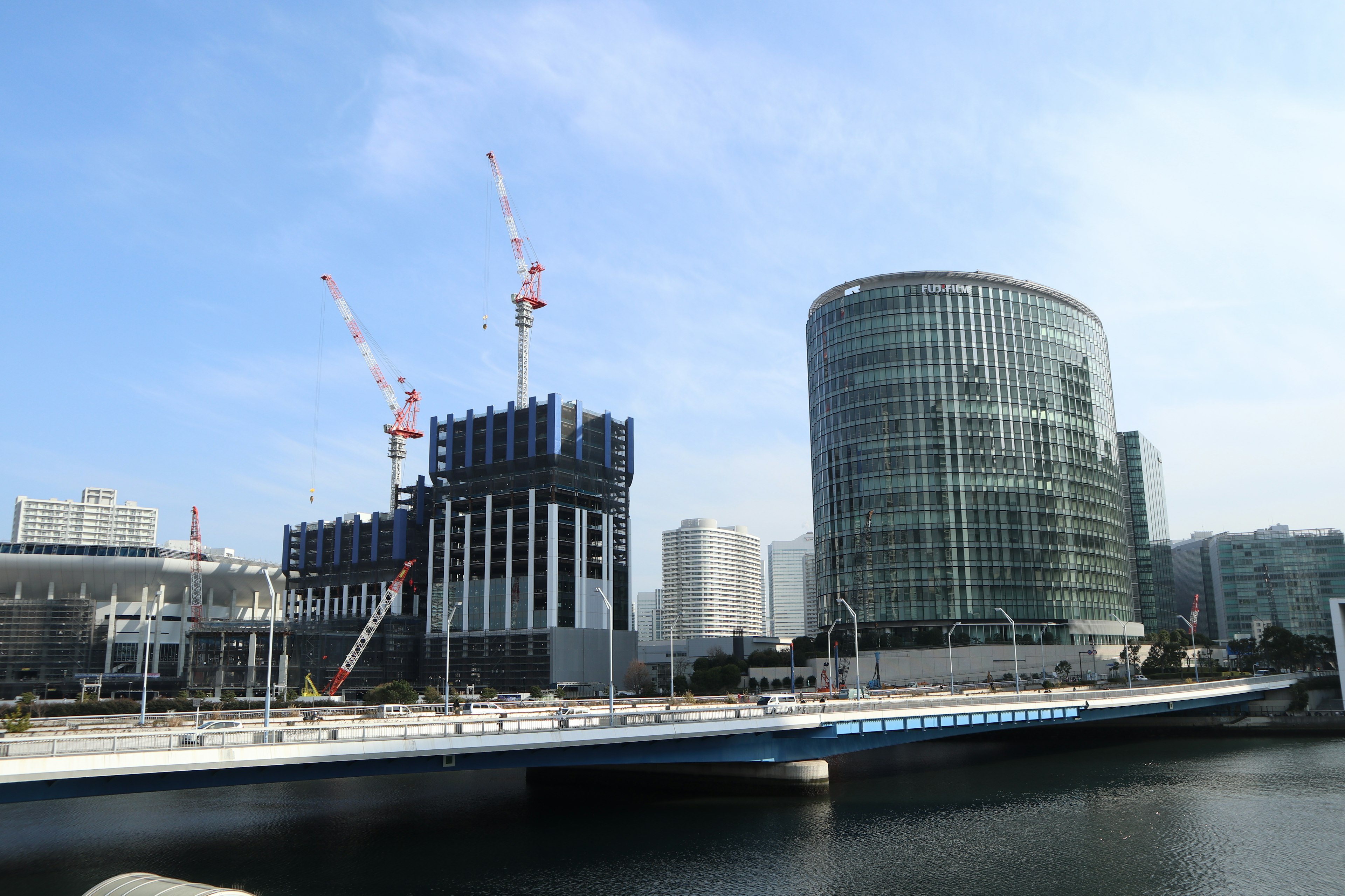 Modern buildings and a construction site with cranes