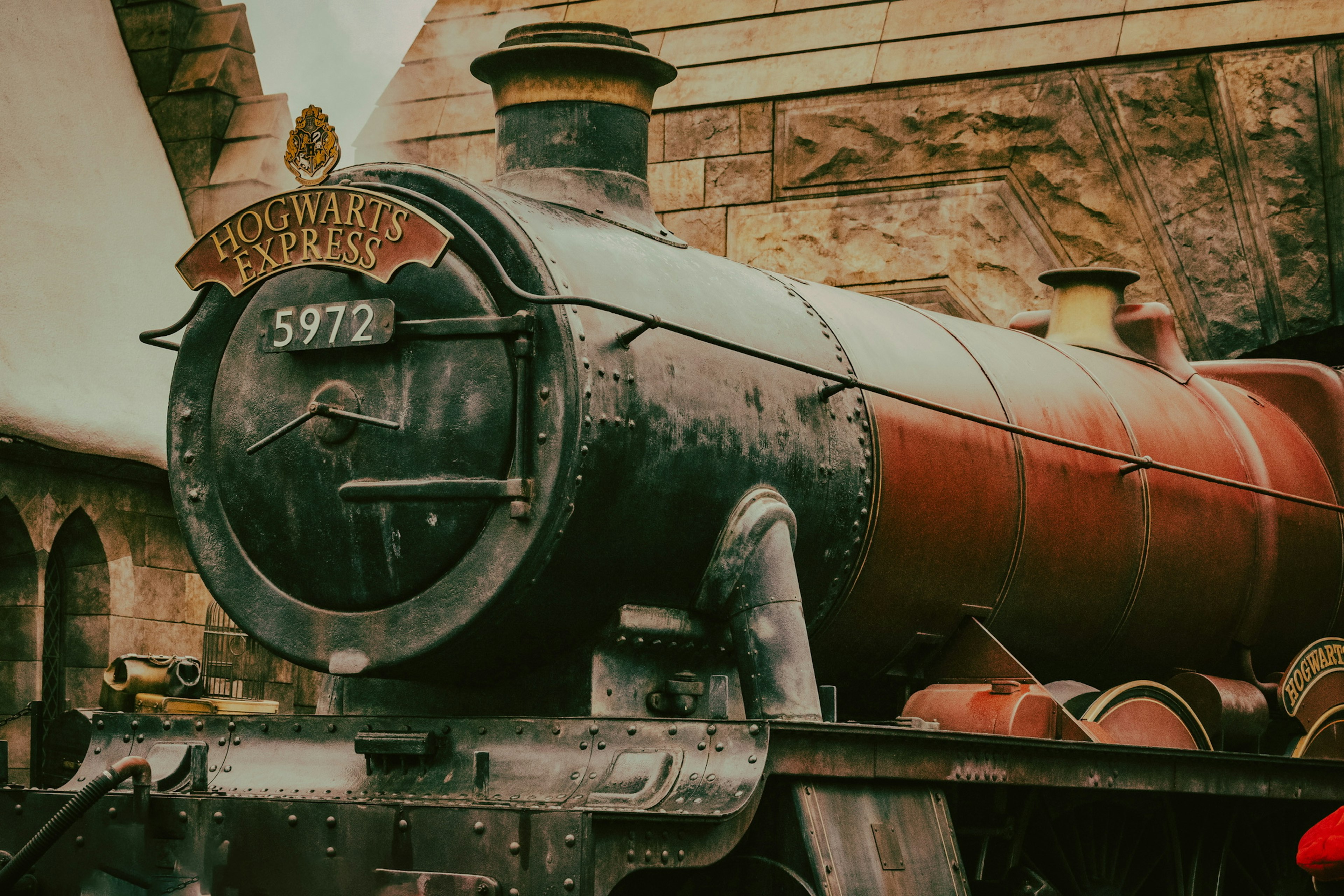 Side view of steam locomotive 5972 showcasing historical railway design and colors