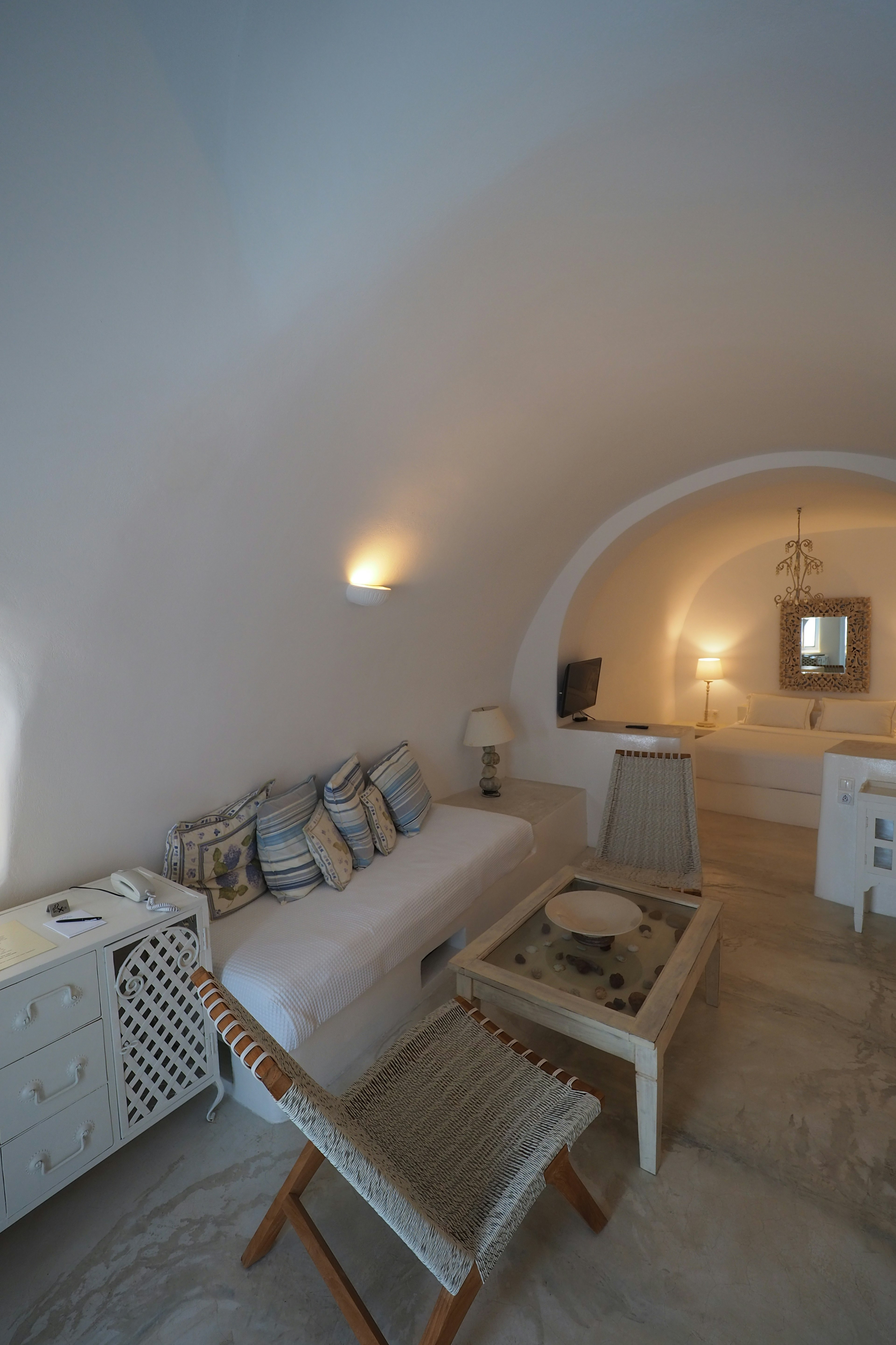 Modern living room interior with white walls and arched ceiling