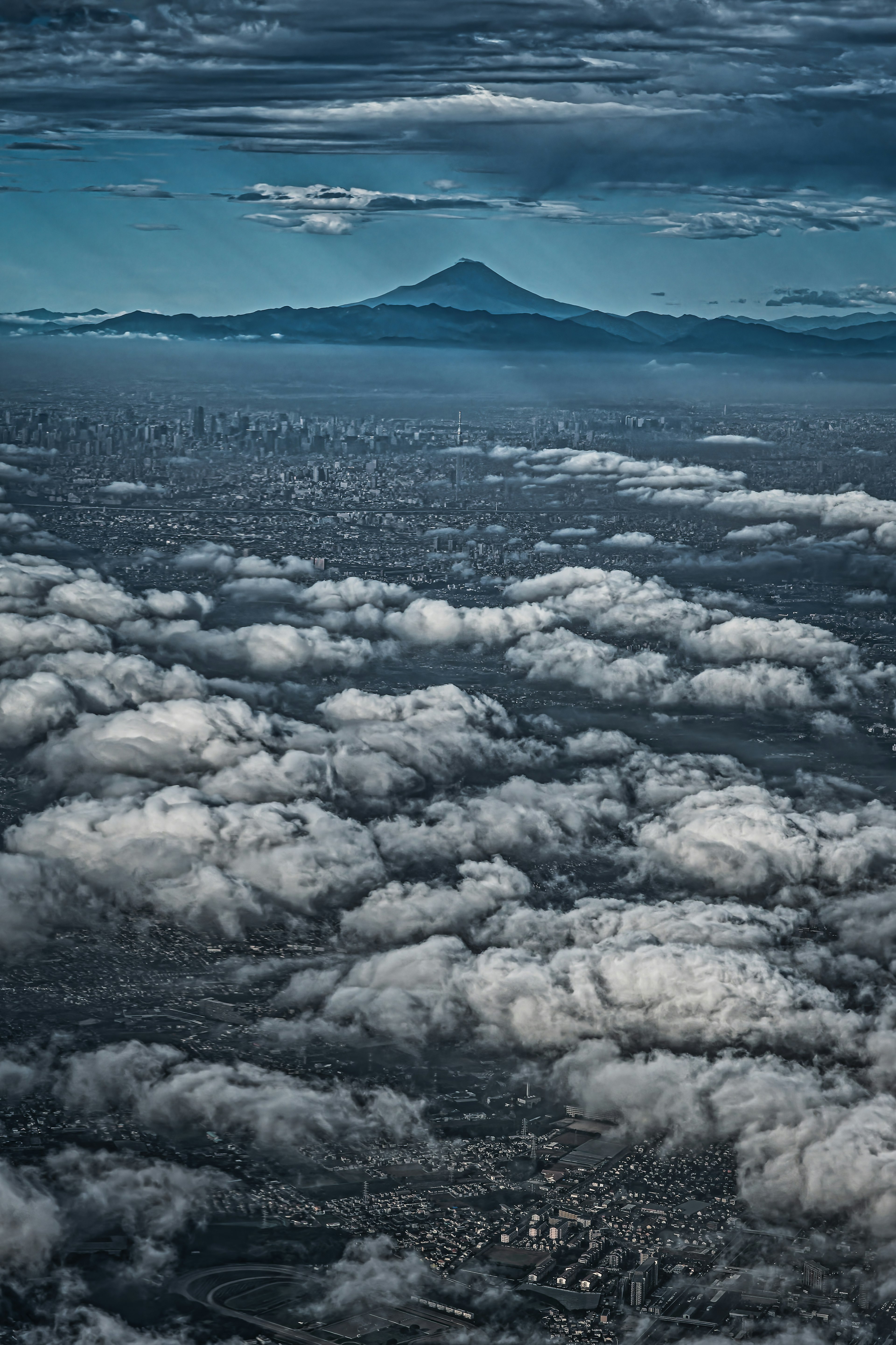 A breathtaking view of Mount Fuji rising above a sea of clouds