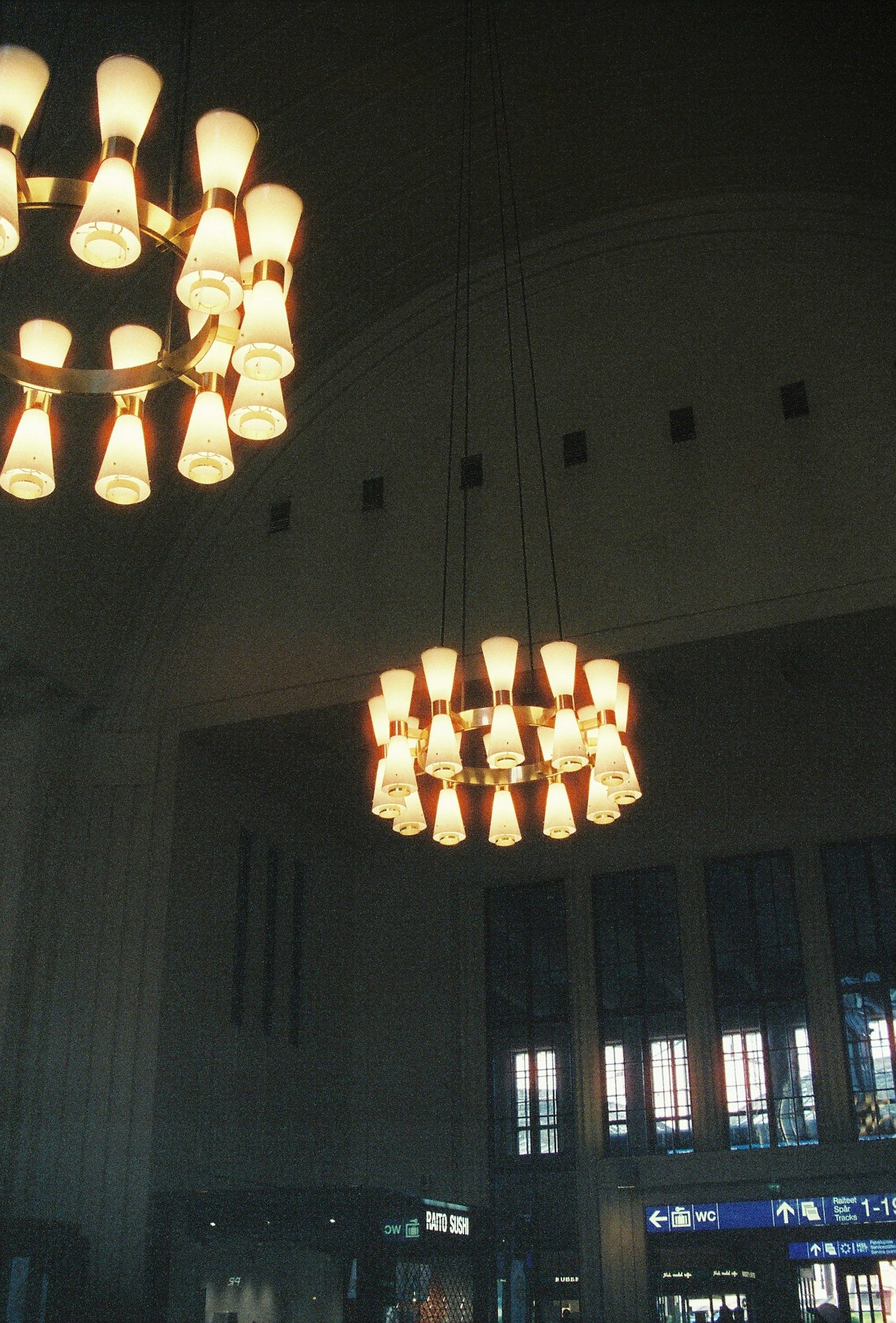 Bright chandeliers hanging in a spacious interior