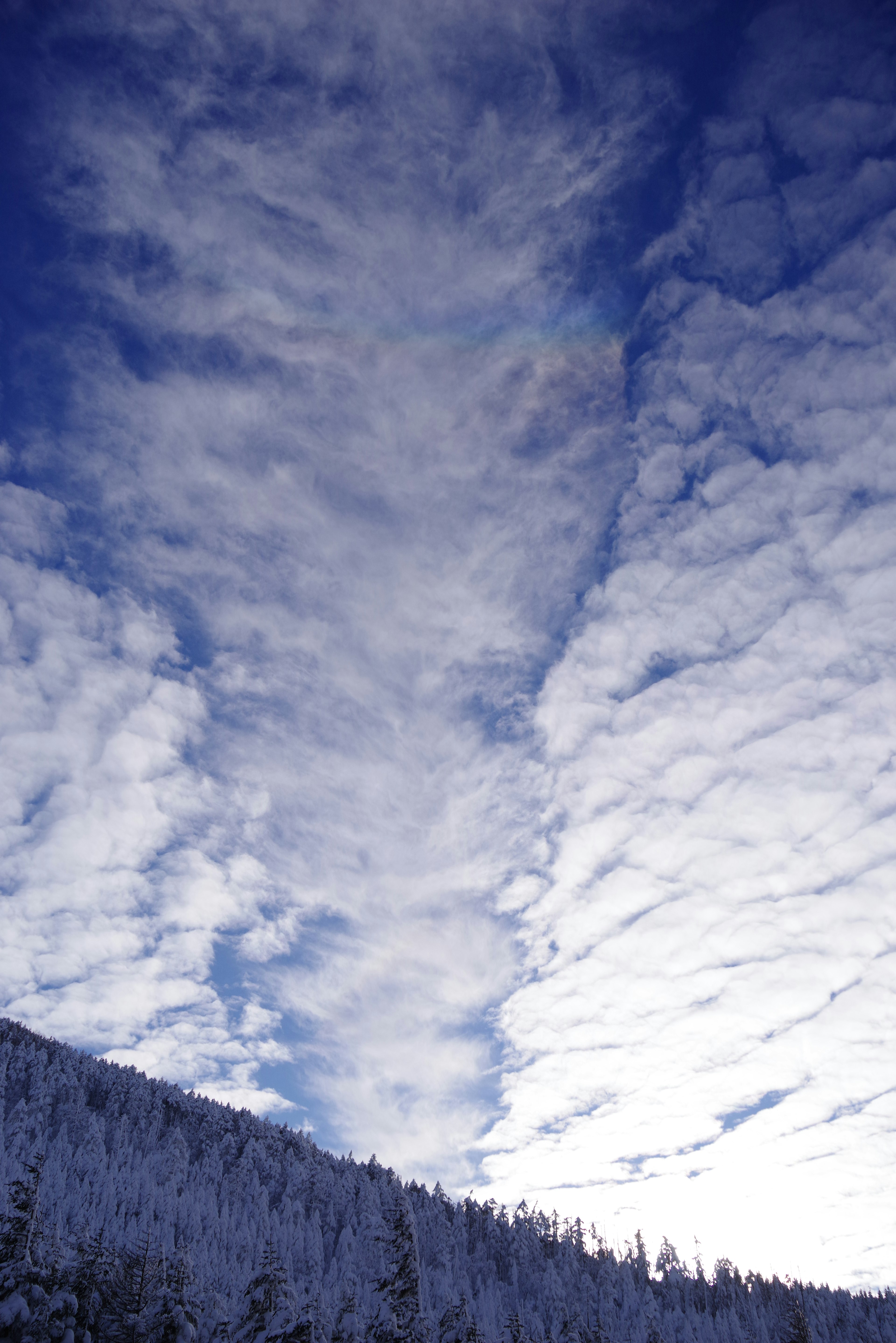 Winter landscape with blue sky and cloud formations