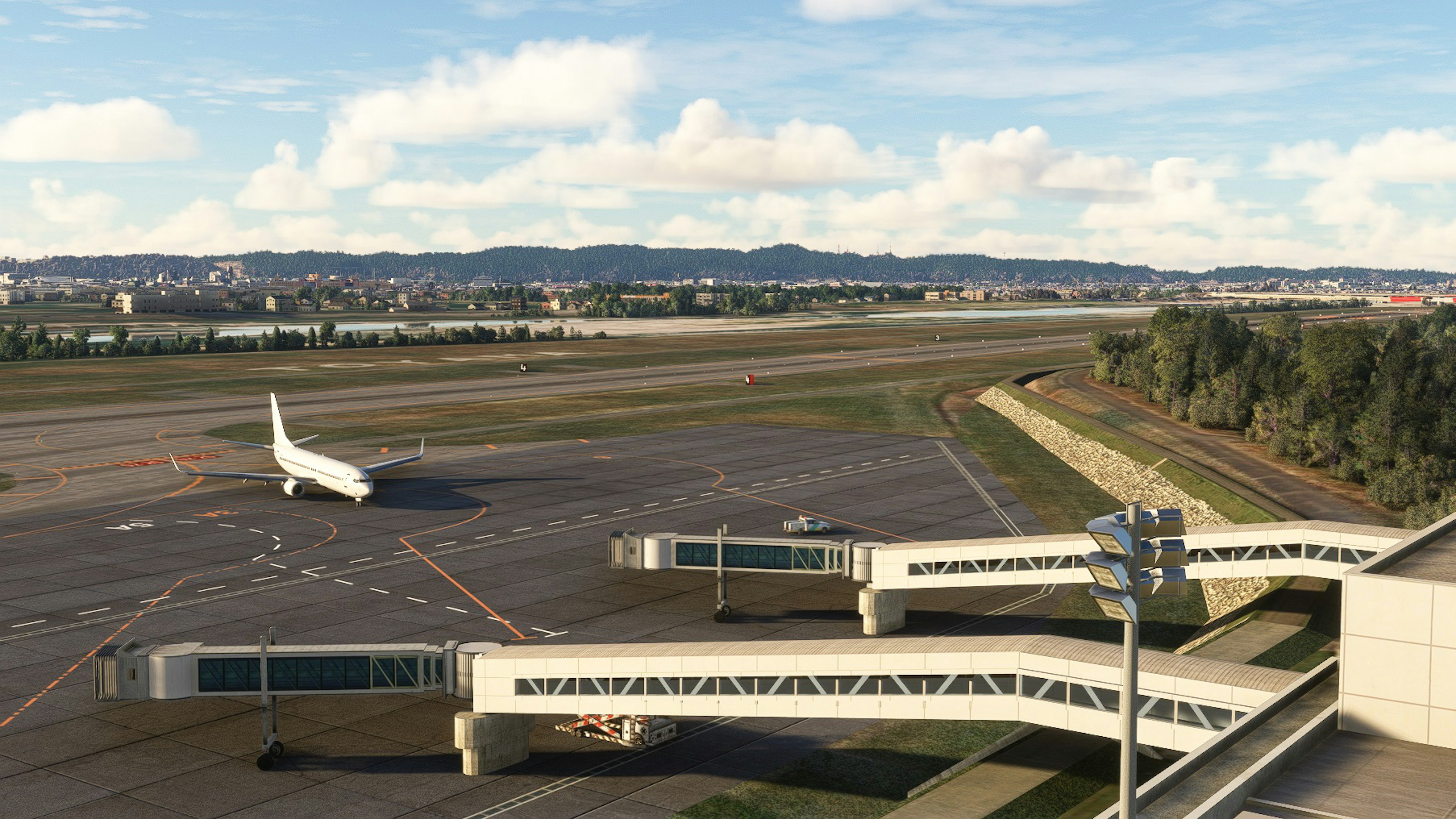 Paesaggio aeroportuale con pista e esterno del terminal