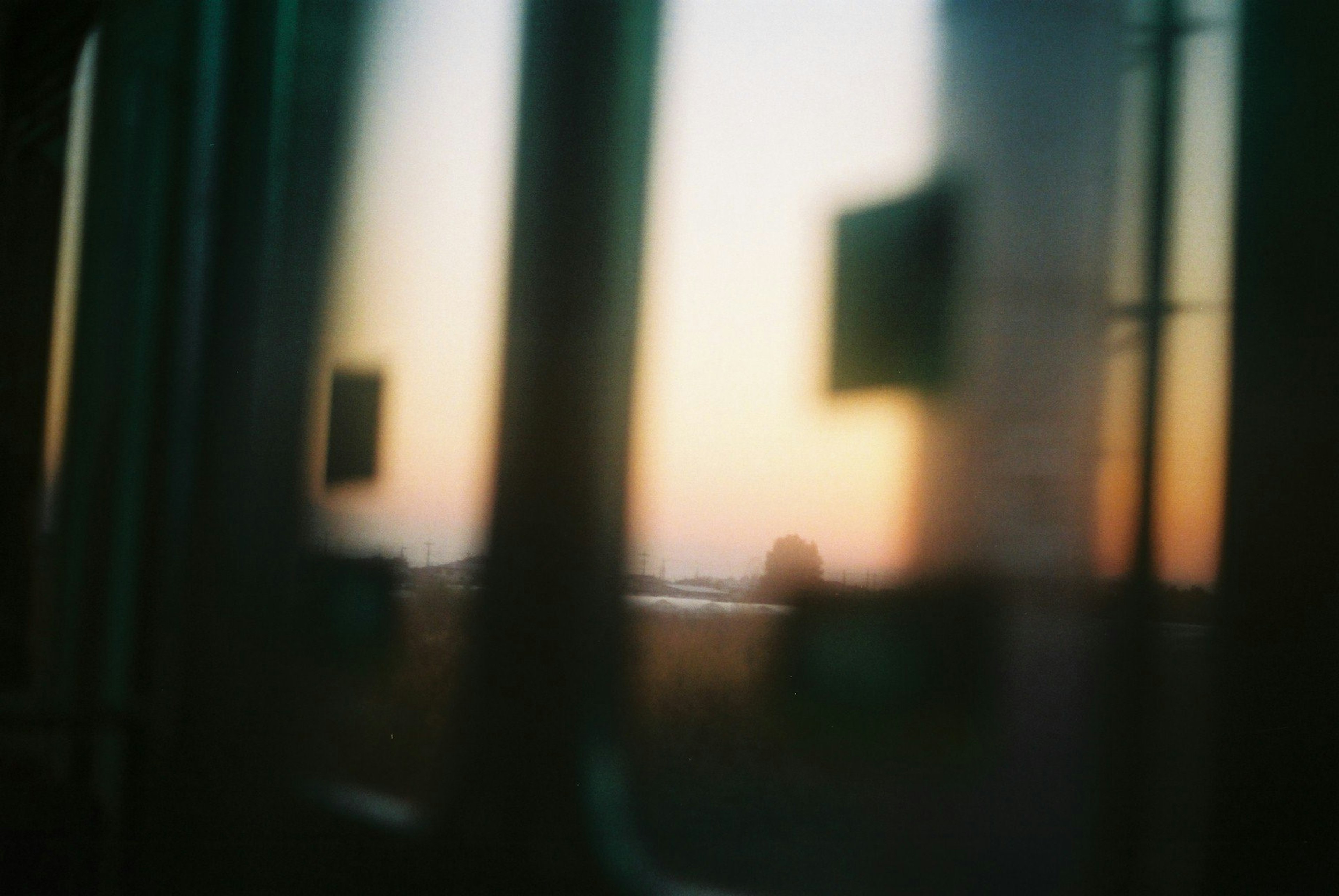 Blurred view of a sunset through a train window