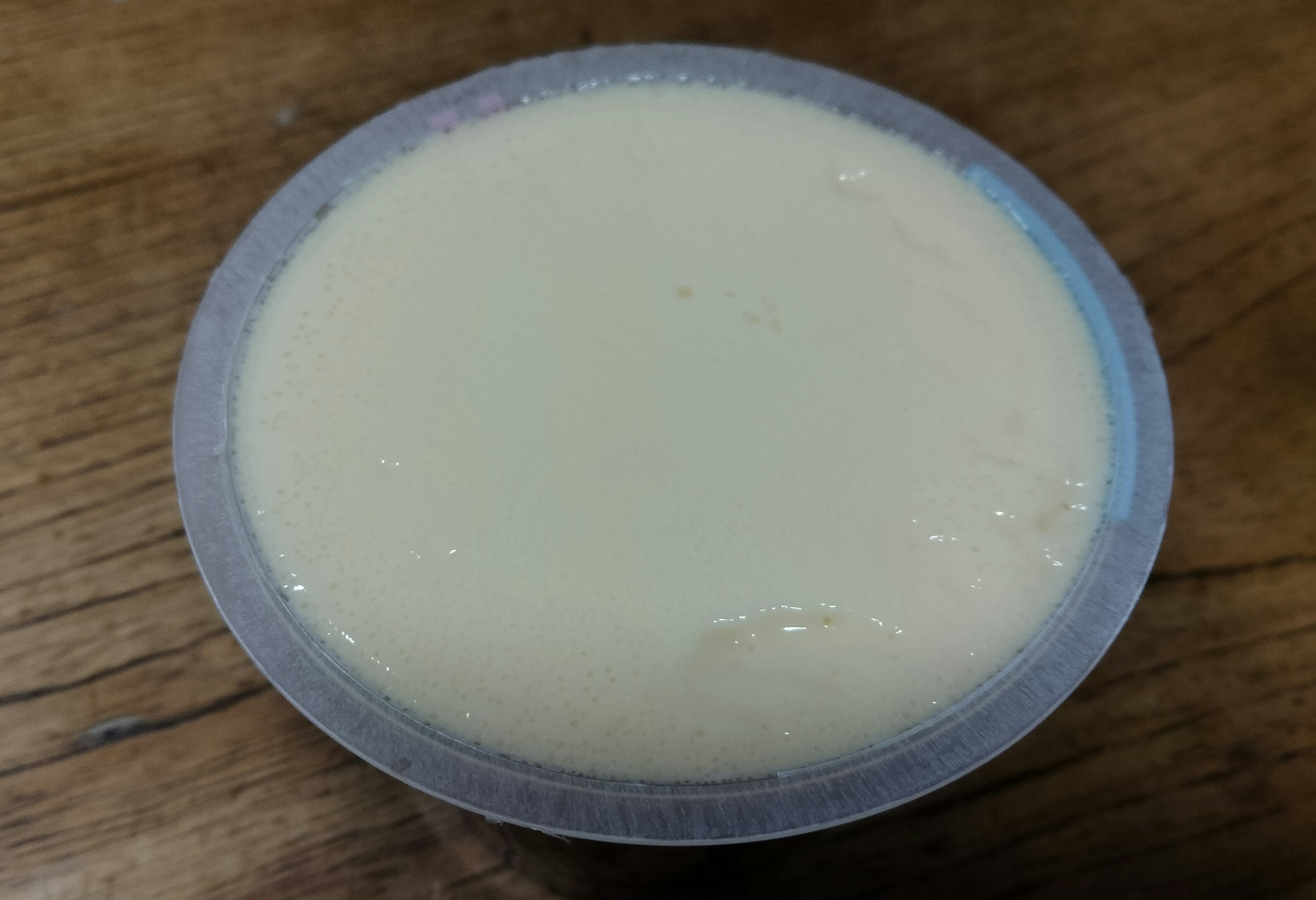 Smooth creamy dessert in a clear container